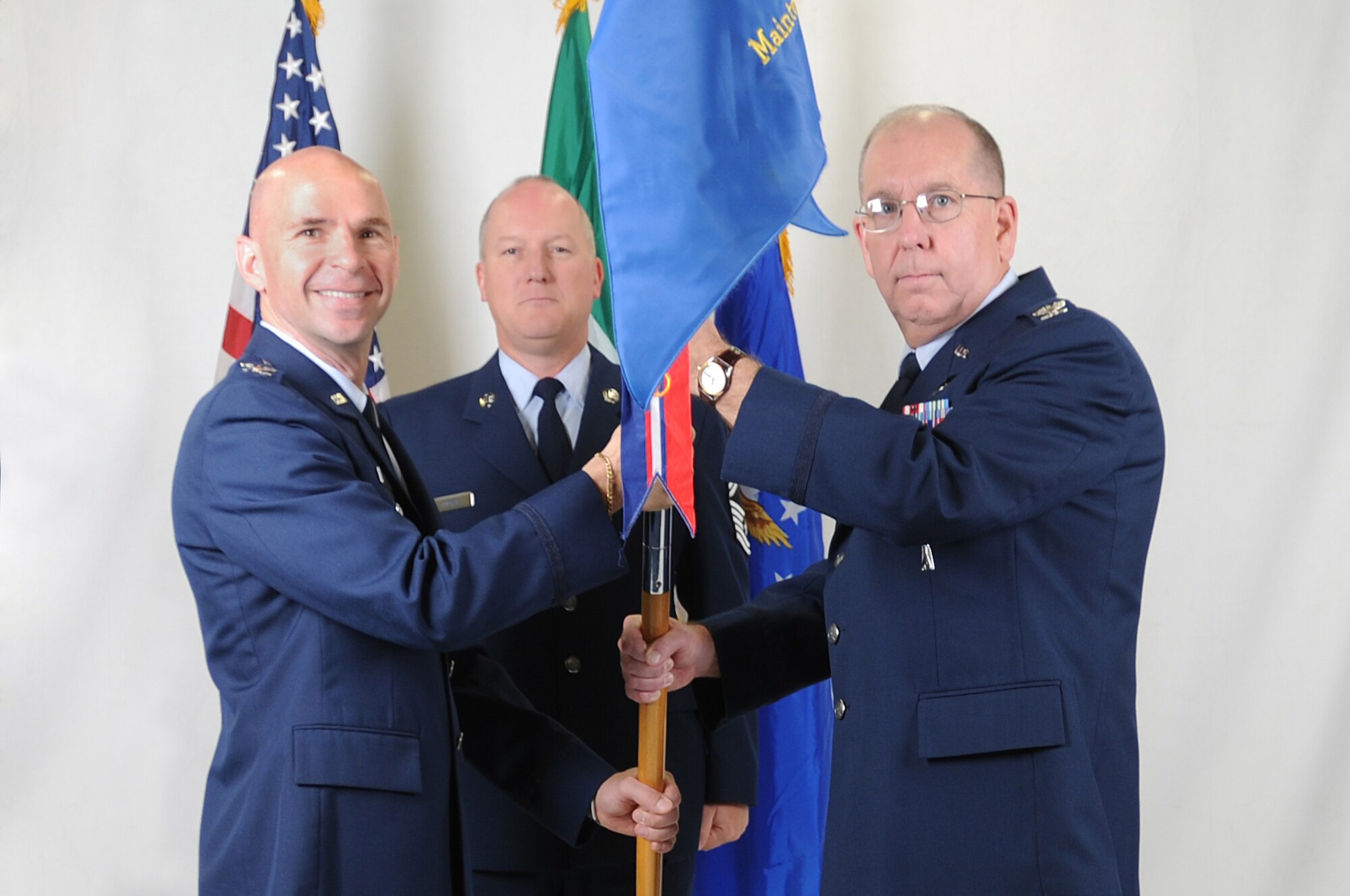 Colonel Dennis Shumaker (right) accepts the 31st Maintenance Group guidon from Col. Patrick McClelland, 31st Fighter Wing vice commander. (U.S. Air Force photo/ Staff Sgt. Patrick Dixon)
