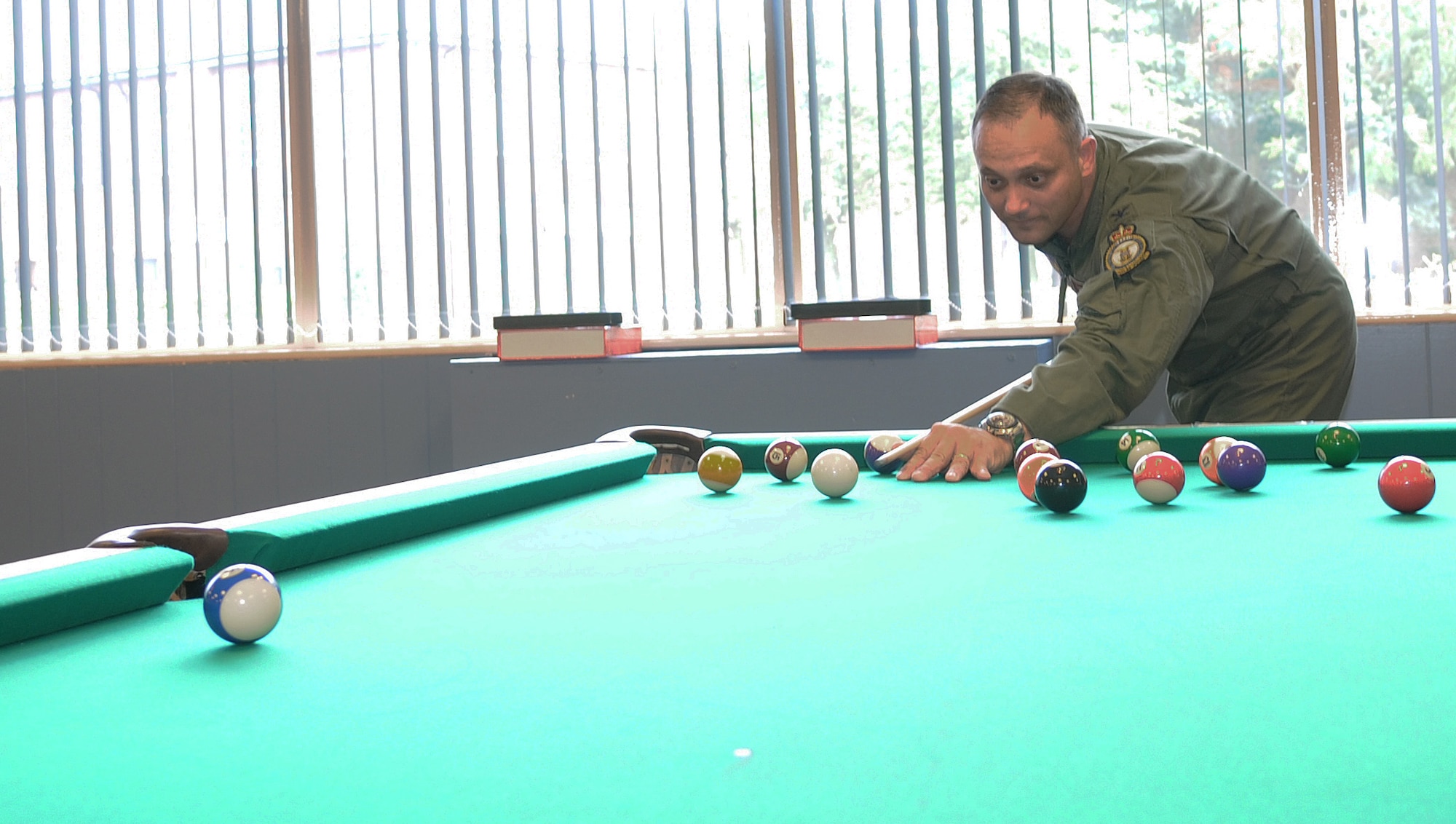 RAF MILDENHALL, England -- Col. Michael Winters, 100th Air Refueling Wing vice commander, tests new equipment at the Game Zone at the Bob Hope Community Center Aug. 5. The gaming room was reopened after four months of renovations and the use of $78,000 of U.S. Air Forces in Europe quality of life improvement funds. (U.S. Air Force photo by Senior Airman Thomas Trower)