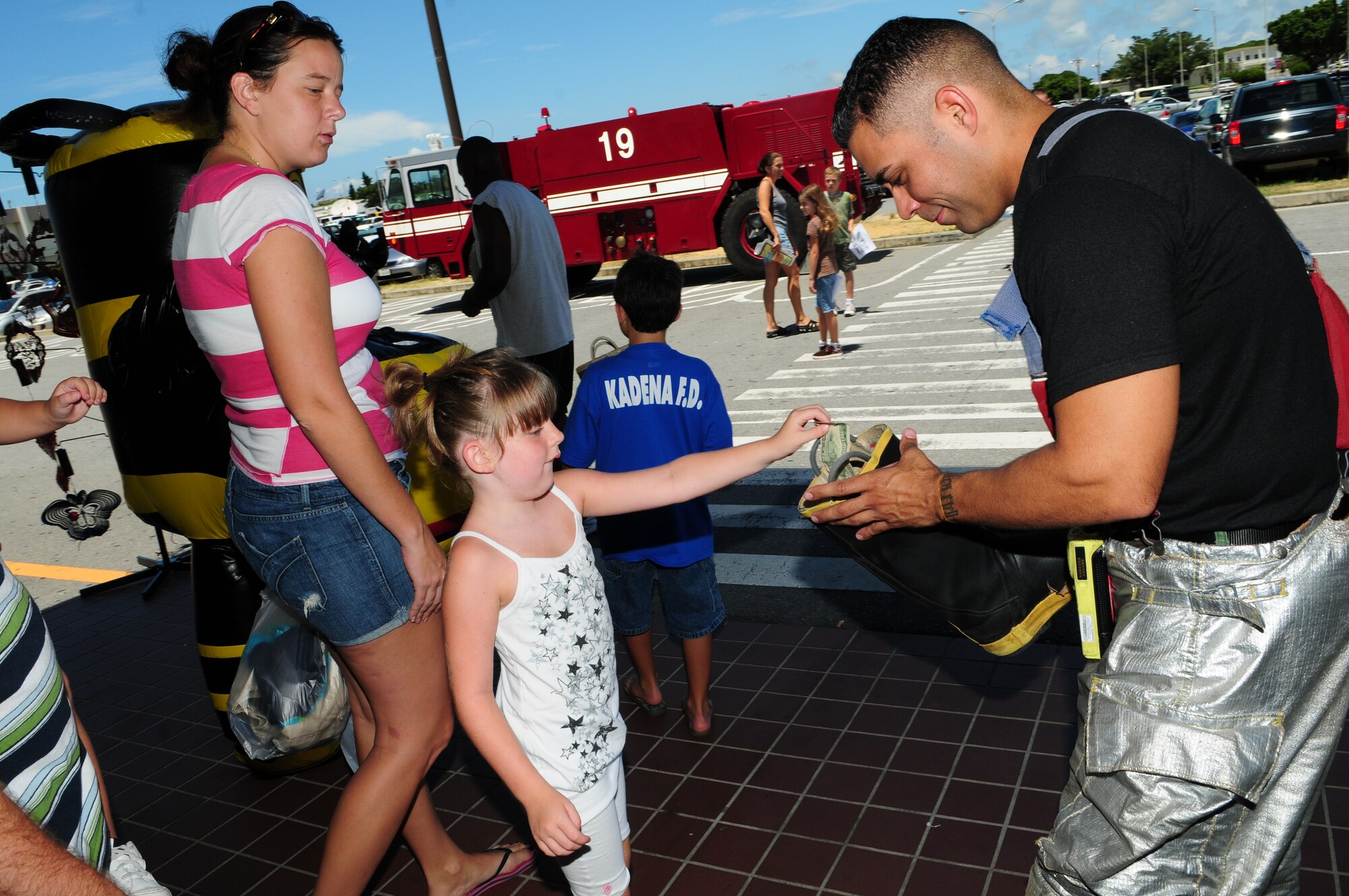 The Kadena Fire Department helped raise donations for the Special Olympics
during the fundraiser, "Fill the Boot" near the base exchange, commissary,
and shoppette area Aug. 15. The fire department raised a total of $17,000
over the weekend.  (U.S. Air Force photo/Tech. Sgt. Rey Ramon)   
