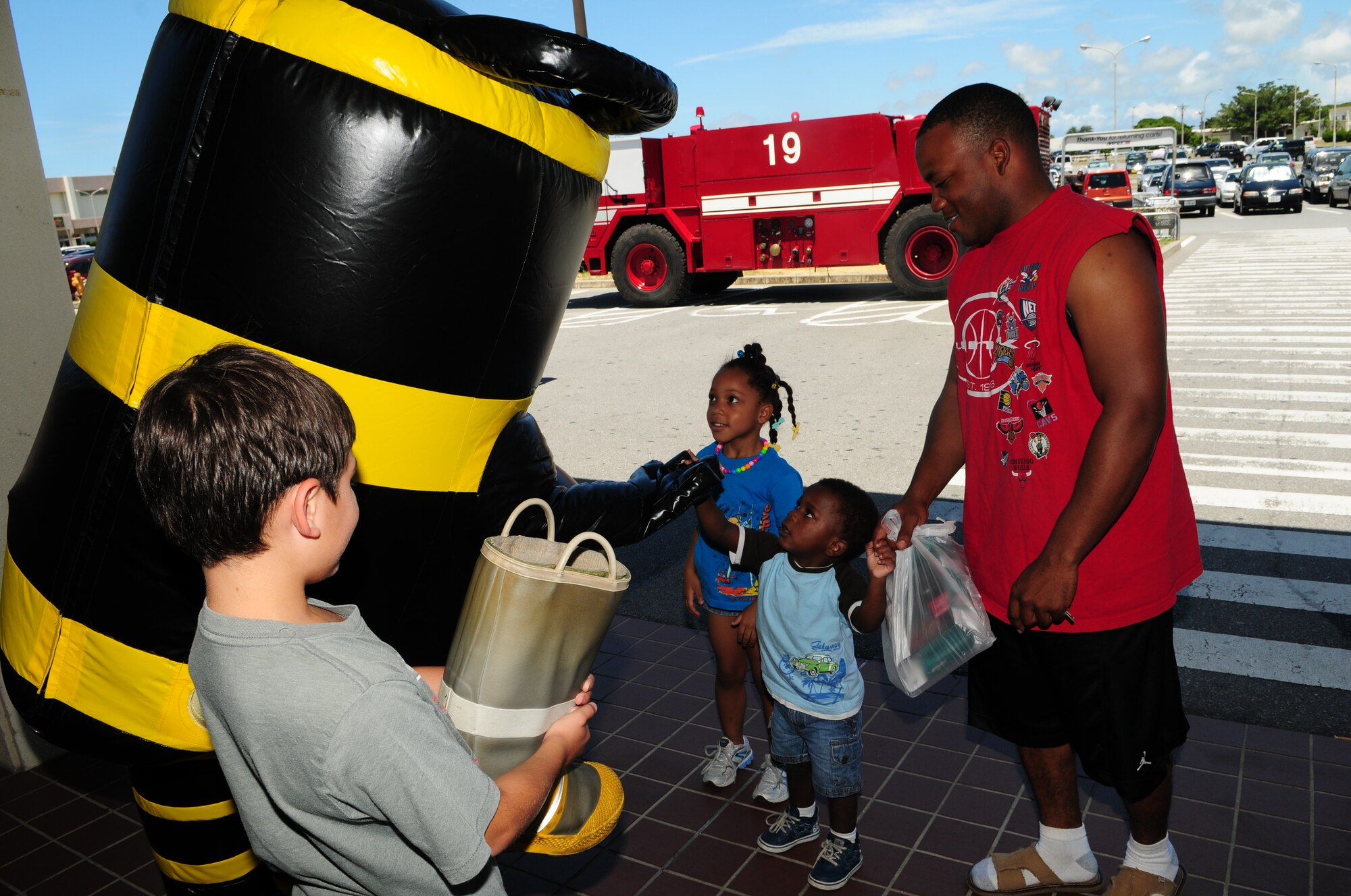 The Kadena Fire Department helped raise donations for the Special Olympics
during the fundraiser, "Fill the Boot" near the base exchange, commissary,
and shoppette area Aug. 15. The fire department raised a total of $17,000
over the weekend.  (U.S. Air Force photo/Tech. Sgt. Rey Ramon)   
