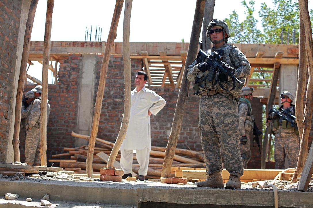 U.S. Army Sgt. David Conrad provides security during a reconnaissance mission to evaluate the progress of the Omar Shahid School's construction site in Kapisa province, Afghanistan, Aug. 9, 2009. Conrad is assigned to the Kapisa-Parwan Provincial Reconstruction Team.