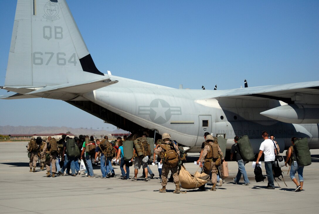 Marines from the 11th Marine Expeditionary Unit board a KC-130J Hercules from Marine Aerial Refueler Transport Squadron 352 during a noncombatant operation exercise on the station flight ine Aug. 17, 2009. The NEO was part of the 11th MEU's special operations capable certification process. The training prepared the unit for their upcoming deployment this fall. A detachment from Yuma's Marine Attack Squadron 513 is scheduled to join the 11th MEU for the deployment.