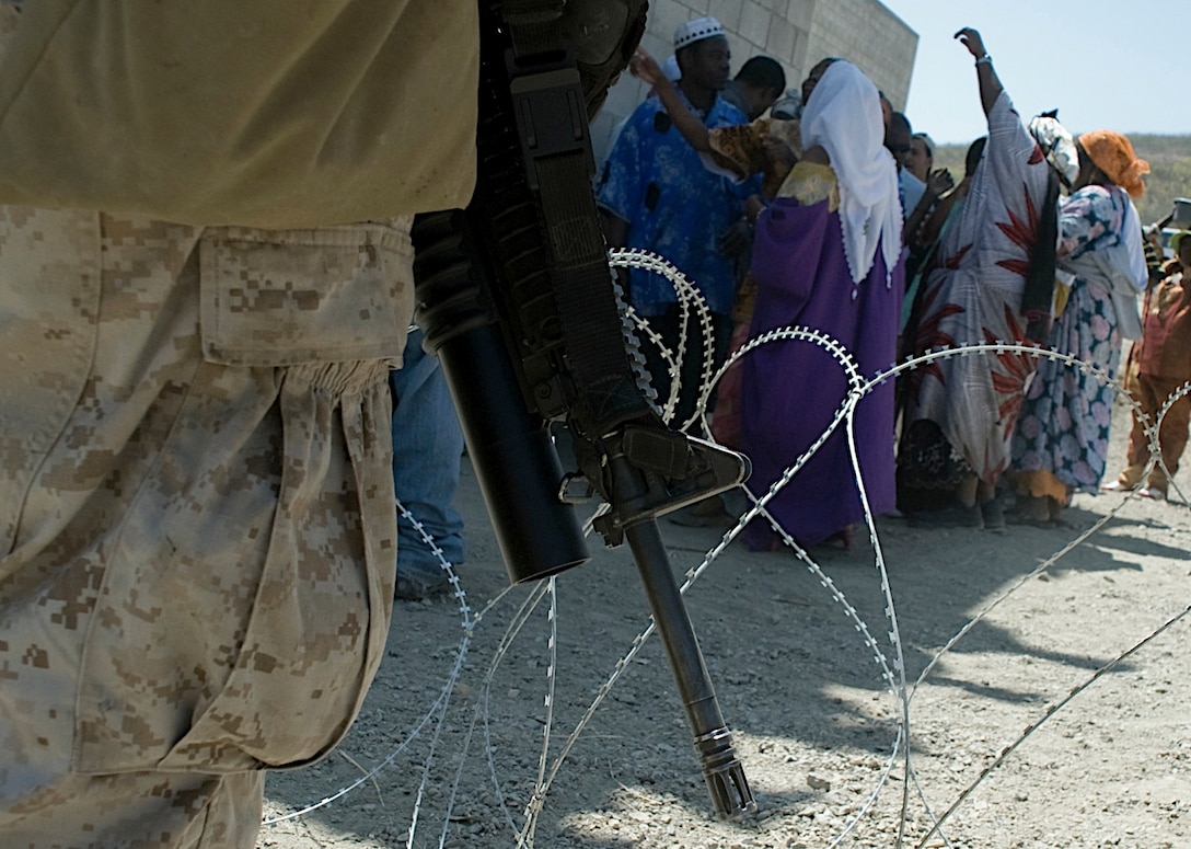 An 11th Marine Expeditionary Unit Marine stands security during a mass casualty evacuation exercise Aug. 17. Members of the 11th MEU trained for several missions Aug. 16-17, including humanitarian assistance operations, noncombatant evacuation operations and mass casualty evacuations. The MEU is currently at sea until Aug. 21 conducting their certification exercise, the final piece of their training before deploying later this year.