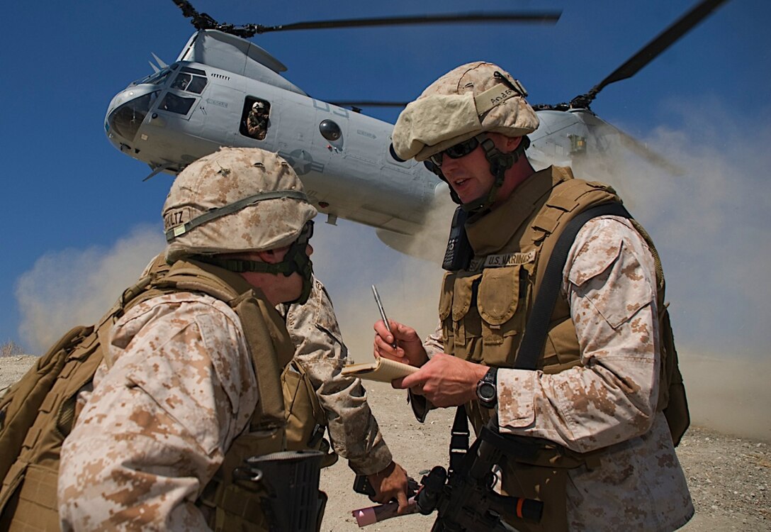 Cpl. Gabe Anderson, from Moorhead, Minn., keeps a count of personnel as a CH-46E Sea Knight helicopter lands behind 11th Marine Expeditionary Unit Marines as they conduct a mass casualty evacuation exercise here Aug. 17. Members of the 11th MEU trained for several missions Aug. 16-17, including humanitarian assistance operations, noncombatant evacuation operations and mass casualty evacuations during the unit’s certification exercise, their final training before deploying later this year. Anderson is a motor transport mechanic with Combat Logistics Battalion 11, 11th MEU.
