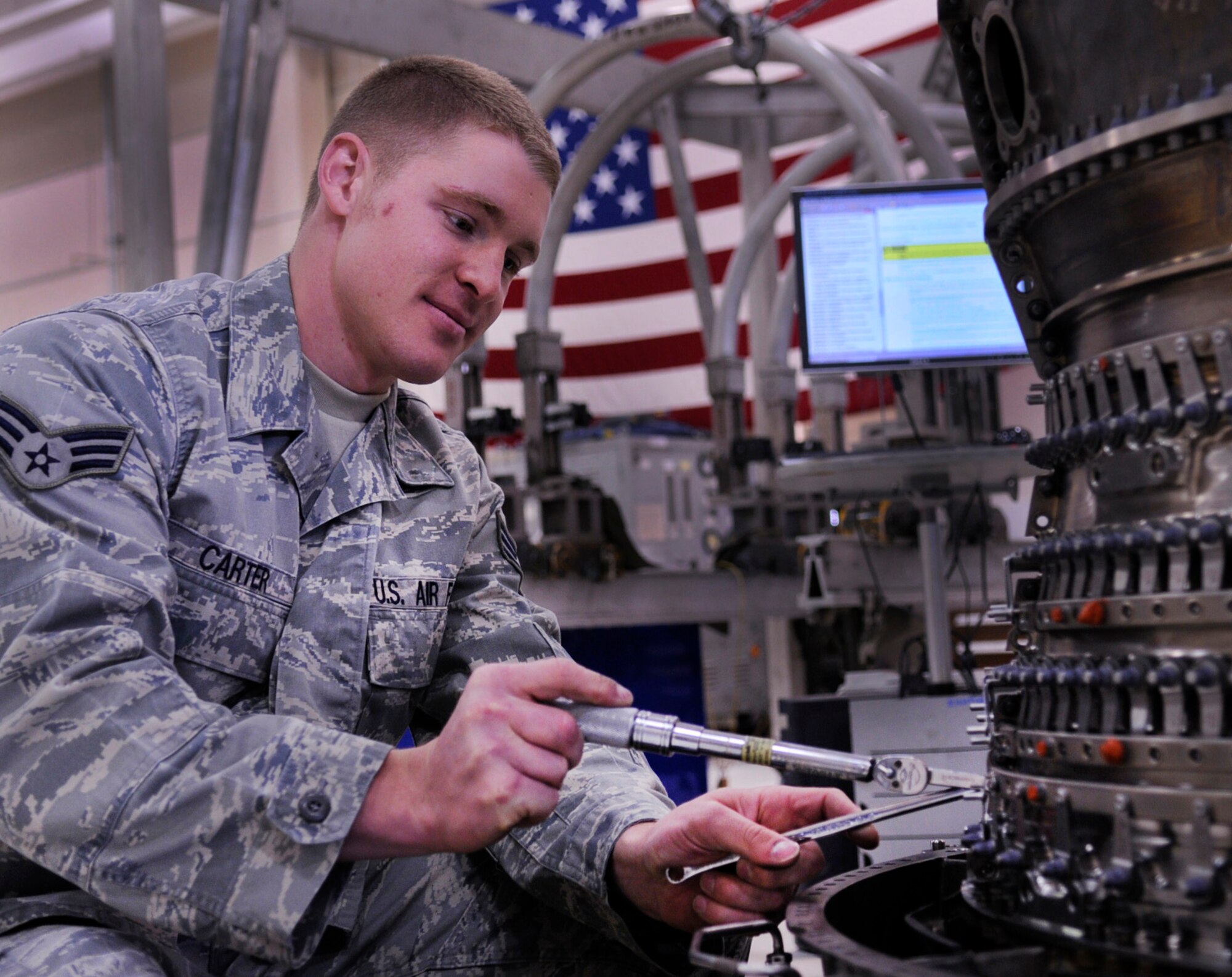 Senior Airman Kyle Carter torques a forward compressor case during assembly of an F-16 Fighting Falcon engine Aug. 12, 2009, Eielson Air Force Base, Alaska. The F-16 has a thrust-to-weight ratio greater than one, providing power to climb and accelerate vertically. Airman Carter is an Air Space Propulsions Journeyman assigned to the 354th Maintenance Squadron. (U.S. Air Force photo/Airman 1st Clas Laura Goodgame)