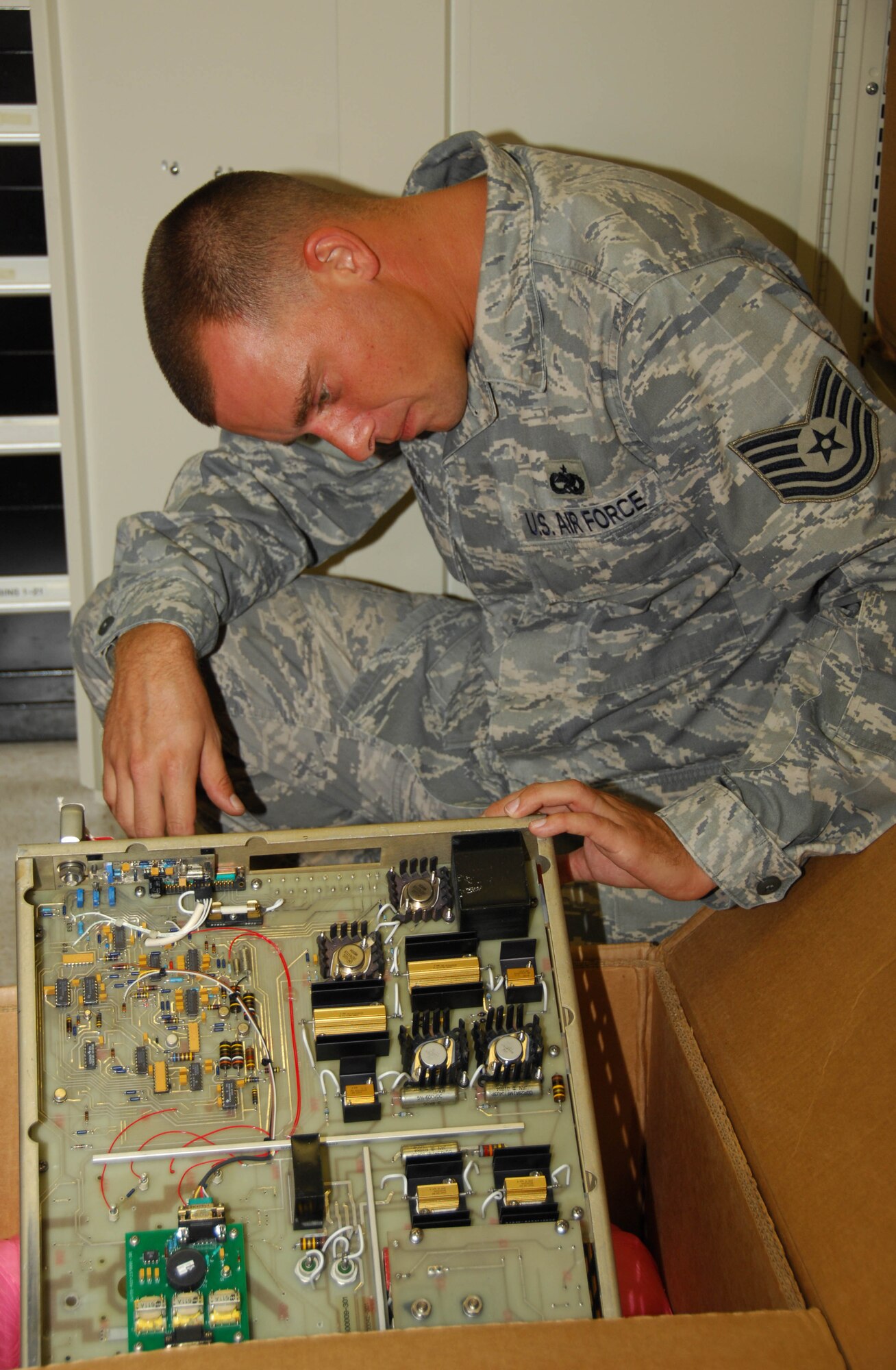 Tech. Sgt. Christopher Johnson checks the inventory number on a component for the Next Generation Weather Radar off-base Aug. 4 in Guam. The Communication Squadron provides maintenance support for the lone weather radar on island. Sergeant Johnson is the 36th Communications Squadron NCO in charge of ground radar systems. (U.S. Air Force photo/Senior Airman Shane Dunaway) 