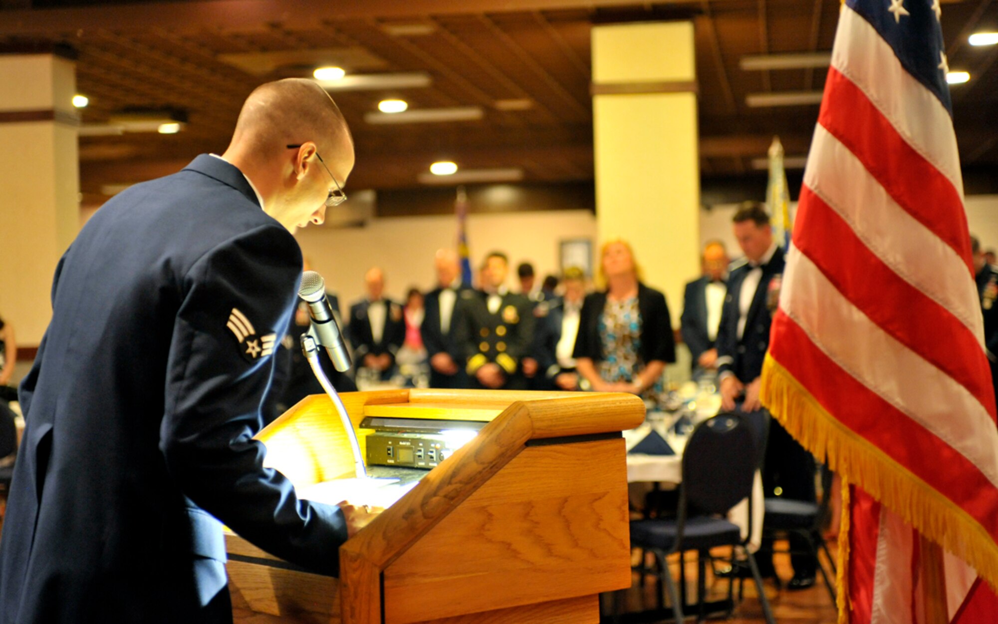 FAIRCHILD AIR FORCE BASE, Wash. – Senior Airman Scott Flowers, 336th Training Support Squadron, gives the benediction for the Airman Leadership School graduation at Club Fairchild Aug. 6. Flowers was also the John Levitow Award recipient for ALS Class 09-6. (U.S. Air Force photo / Senior Airman Jocelyn A. Guthrie)
