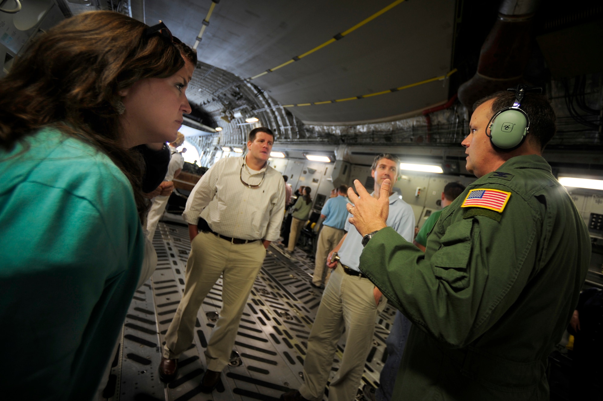 Col. Donald Shaffer briefs civilians from the Charleston area aboard a C-17 before a civic leader orientation flight here Aug. 13. Through the flight, the civilians, not normally exposed to the military, had a chance to experience the Air Force aboard a Charleston C-17. Colonel Shaffer is the 437th Airlift Wing vice commander. (Air Force photo/Staff Sgt. Jacob Bailey)
