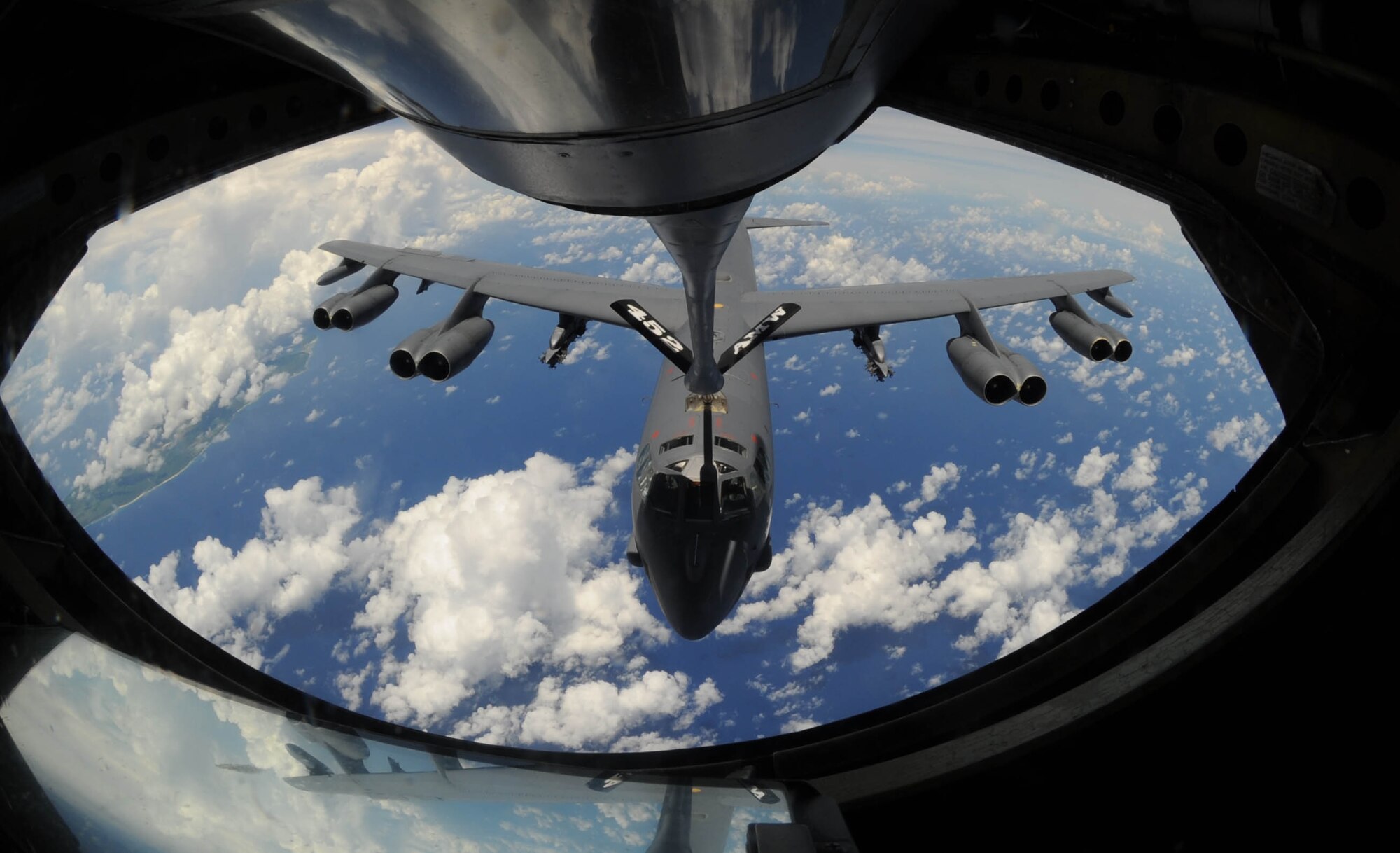 A B-52 Stratofortress bomber approaches for a refueling over the Pacific
Ocean Aug. 13. KC-135 Stratotankers, F-22 Raptors and B-52 Stratofortress
bombers took part in the 2009 Inaugural Turkey Shoot Competition, which allows air
expeditionary units to plan and execute tactical missions with airframes
that don't regularly train together.  The B-52's are deployed from Barksdale
Air Force Base, La., to Andersen AFB, Guam, to support U.S. Pacific
Command's Continuous Bomber Presence in the Asia-Pacific region.  (U.S. Air
Force photo/Senior Airman Christopher Bush)

