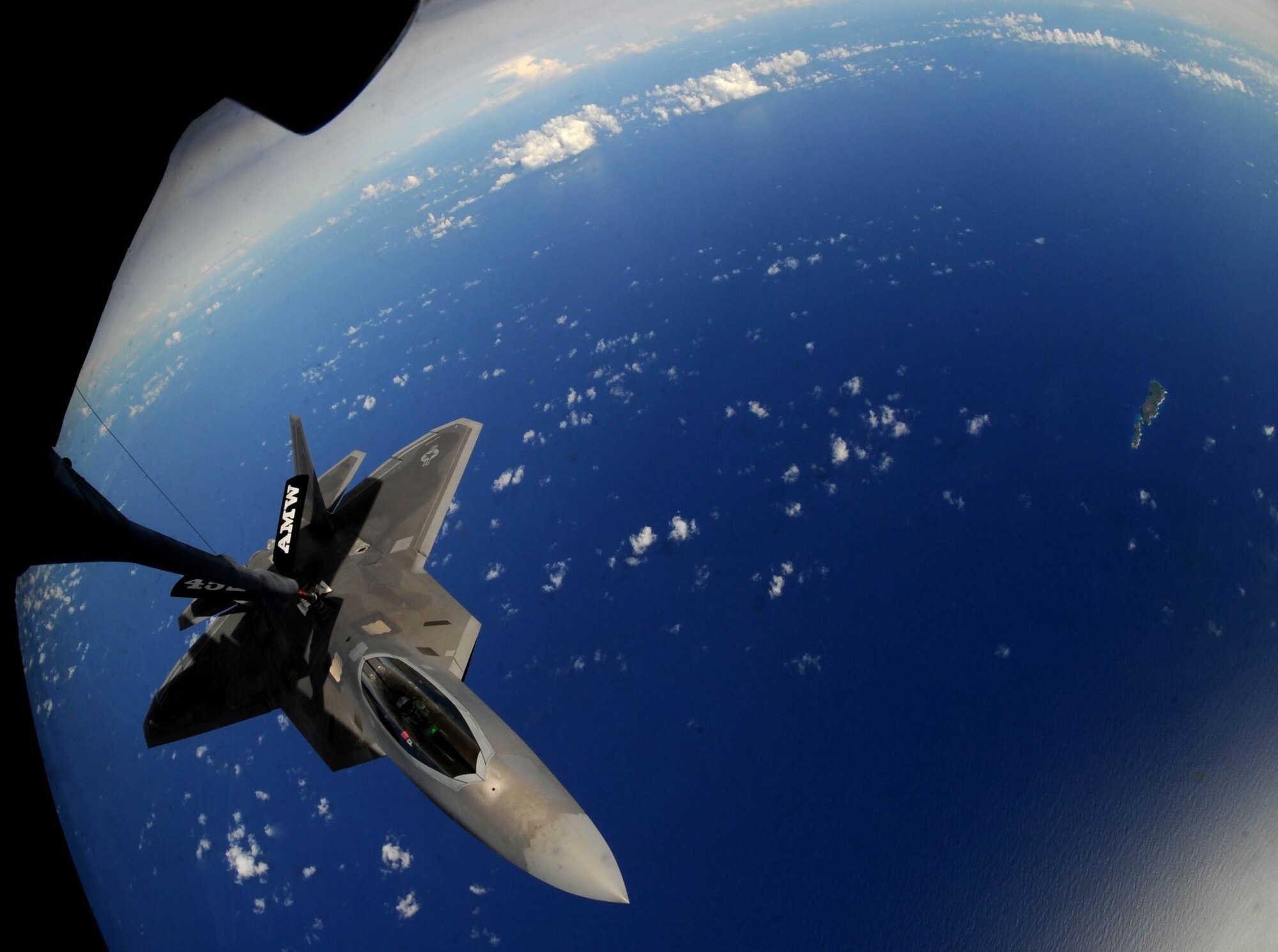 A F-22 Raptor approaches the boom of a KC-135 Stratotanker to refuel over
the Pacific Ocean Aug. 13.  KC-135 Stratotankers, F-22 Raptors and B-52
Stratofortress bombers took part in the 2009 Inaugural Turkey Shoot, which
allows air expeditionary units to plan and execute tactical missions with
airframes that don't regularly train together. The F-22s are deployed from
Elmendorf Air Force Base, Alaska, to Andersen AFB, Guam, to support U.S.
Pacific Command's Theater Security Package in the Asia-Pacific region.
(U.S. Air Force photo/Senior Airman Christopher Bush)