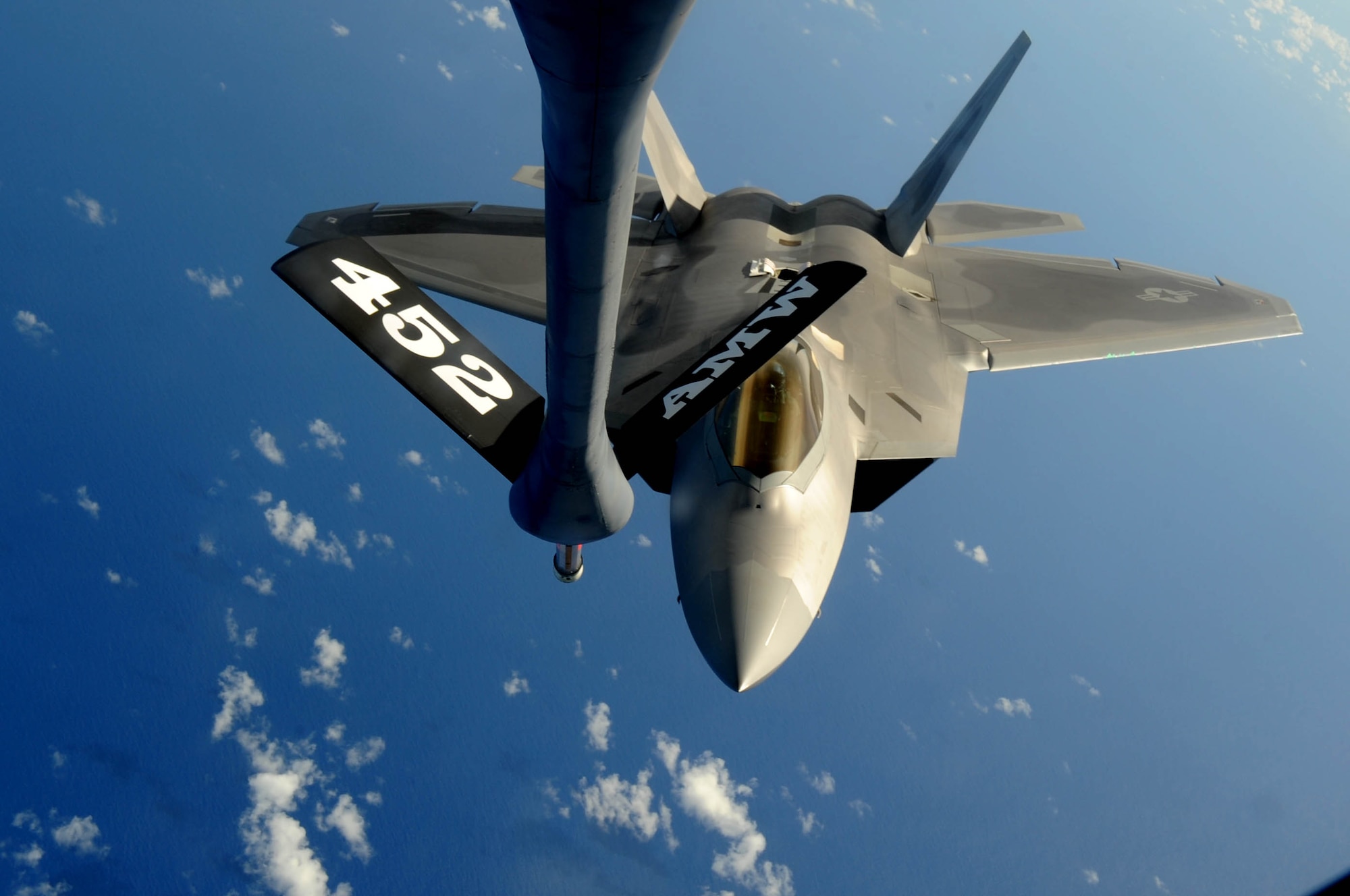 A F-22 Raptor approaches the boom of a KC-135 Stratotanker to refuel over
the Pacific Ocean Aug. 13.  KC-135 Stratotankers, F-22 Raptors and B-52
Stratofortress bombers took part in the 2009 Inaugural Turkey Shoot, which
allows air expeditionary units to plan and execute tactical missions with
airframes that don't regularly train together. The F-22s are deployed from
Elmendorf Air Force Base, Alaska, to Andersen AFB, Guam, to support U.S.
Pacific Command's Theater Security Package in the Asia-Pacific region.
(U.S. Air Force photo/Senior Airman Christopher Bush)