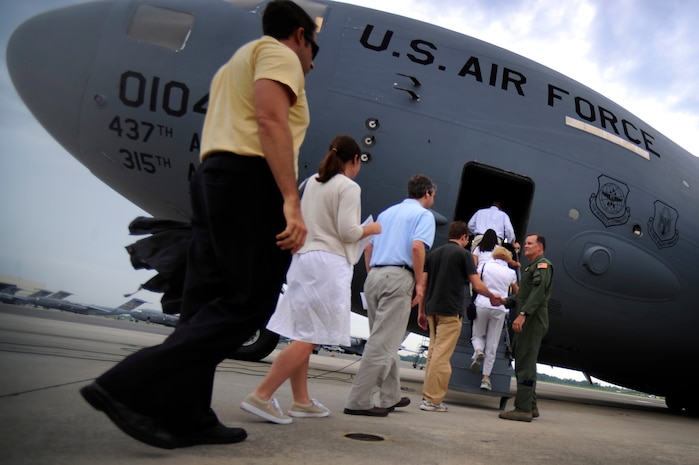 Col. Donald Shaffer welcomes civilians from the Charleston area while boarding a C-17 for a civic leader orientation flight here Aug. 13. The flight offered the chance for Team Charleston members to show what it means to be a part of the Air Force. Colonel Shaffer is the 437th Airlift Wing vice commander. (Air Force photo/Staff Sgt. Jacob Bailey)