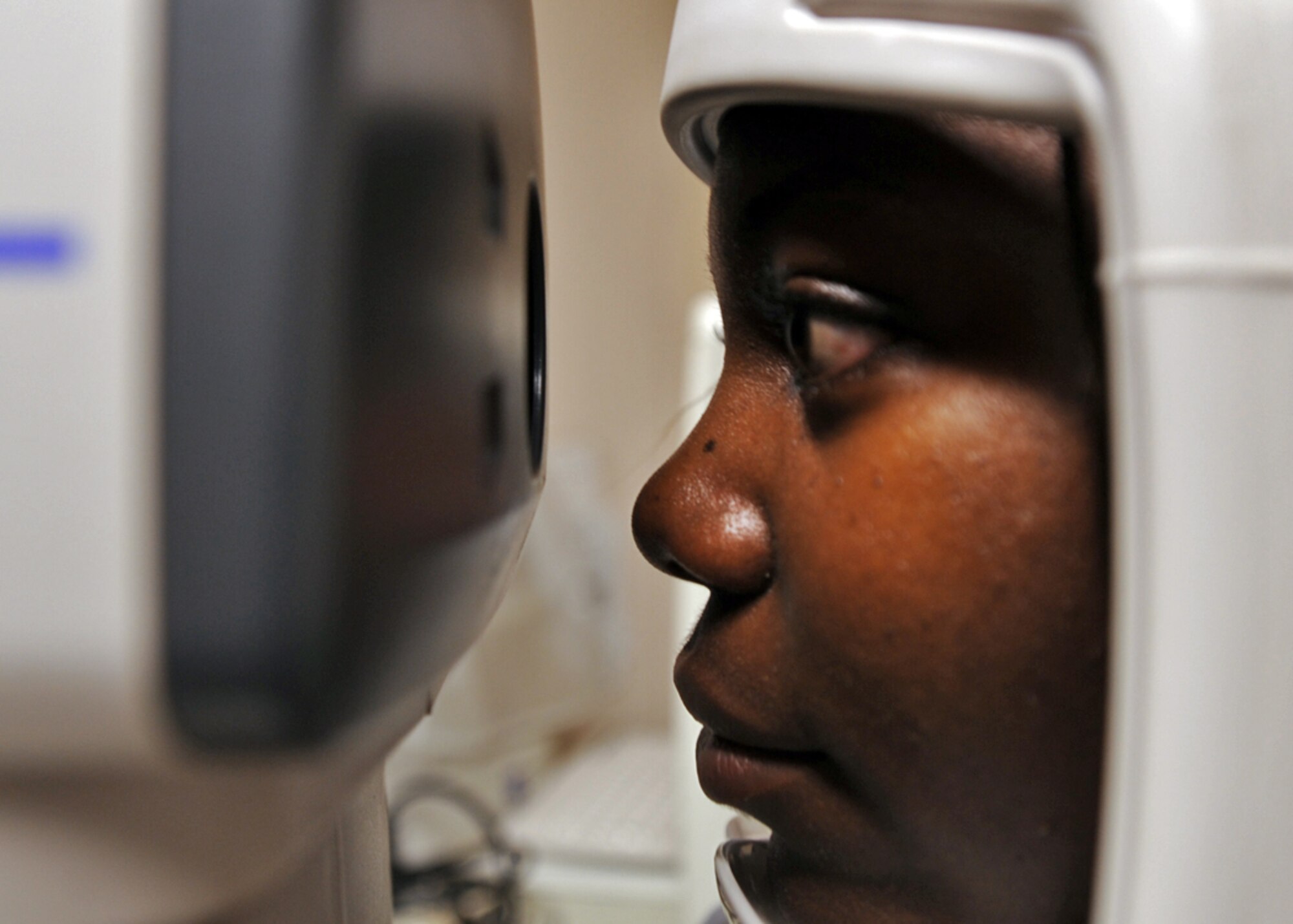 LANGLEY AIR FORCE BASE, Va. -- Ms. Tiffany Alston, certified ophthalmic assistant is given an Auto Kerato-Refraction test here Aug. 18.  August is National Children's Vision and Learning Month, so before children start heading back to the classroom, the American Optometric Association (AOA) recommends a visit to the optometrist.  (U.S. Air Force photo/Airman 1st Class Jonathan Koob) 