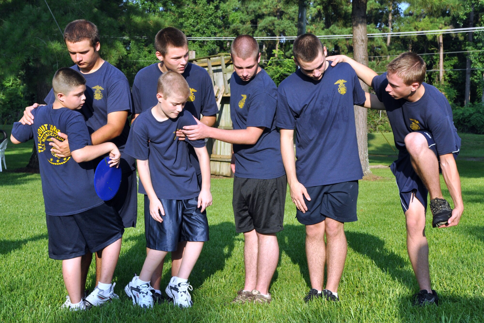 A group of cadets from the TYLER JOINT FORCE Battalion of the U.S. Naval Sea Cadets Corps based in Tyler, Texas, take part in an exercise called “Chocolate River” at the East Texas Medical Center’s Behavioral Health Center in Tyler, August 15, 2009. The exercise is used to enhance team building, planning and communication skills between the participants. The cadets spent the entire summer day completing exercises which will enable them to work closer with and trust their fellow cadets. This experience will also benefit those cadets who decide to join the U.S. Military in the future. One of the objectives of the NSCC is to develop an appreciation for our Navy’s history, customs, traditions, and its significant role on national defense. (Courtesy photo)