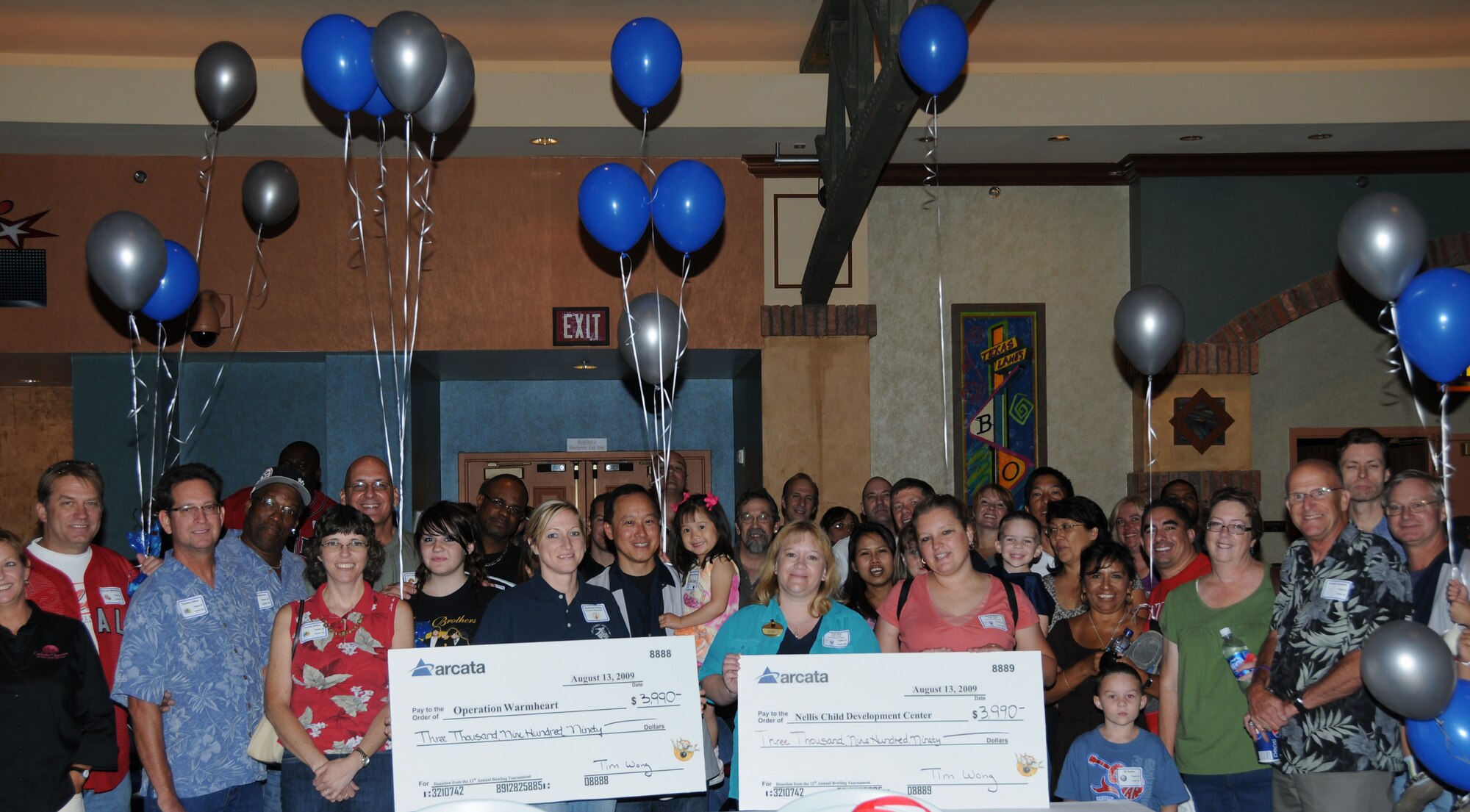 NELLIS AIR FORCE BASE, Nev. -- Arcata employees and their families participate in Arcata's 12th Annual Bowling Tournament which raised $7,980 for two Nellis organizations:  Operation Warm Heart and the Nellis Child Development Center.  The event was held Aug. 13 at the Texas Star Lanes at the Texas Station Casino in North Las Vegas.  Arcata currently supports the 98th Range Wing as a major subcontractor to JT3, LLC on the Joint Range Technical Services (J-Tech) Contract. (courtesy photo)

