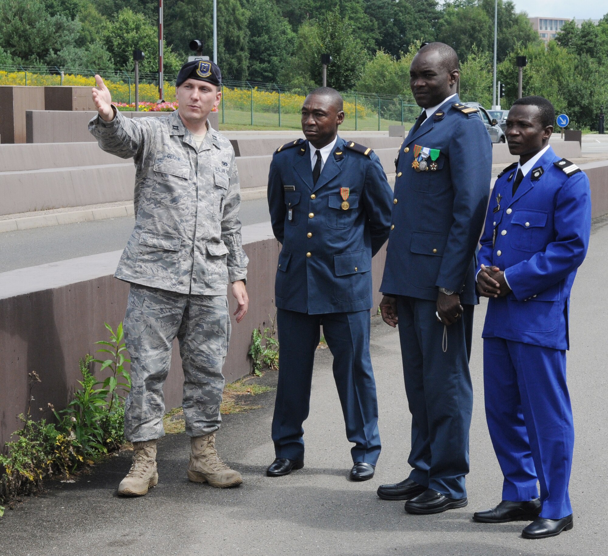 Capt. David Geiger (far left) outlines base entrance security procedures for a delegation of officers from Burkina Faso Aug. 10 at Ramstein Air Base, Germany. The Burkina Faso military members are Lt. Dabir Dapr Paul, Maj. Souleymane Ouedraogo and Capt. Hubert Yameoga. (U.S. Air Force photo/Tech. Sgt. Alec Lloyd) 