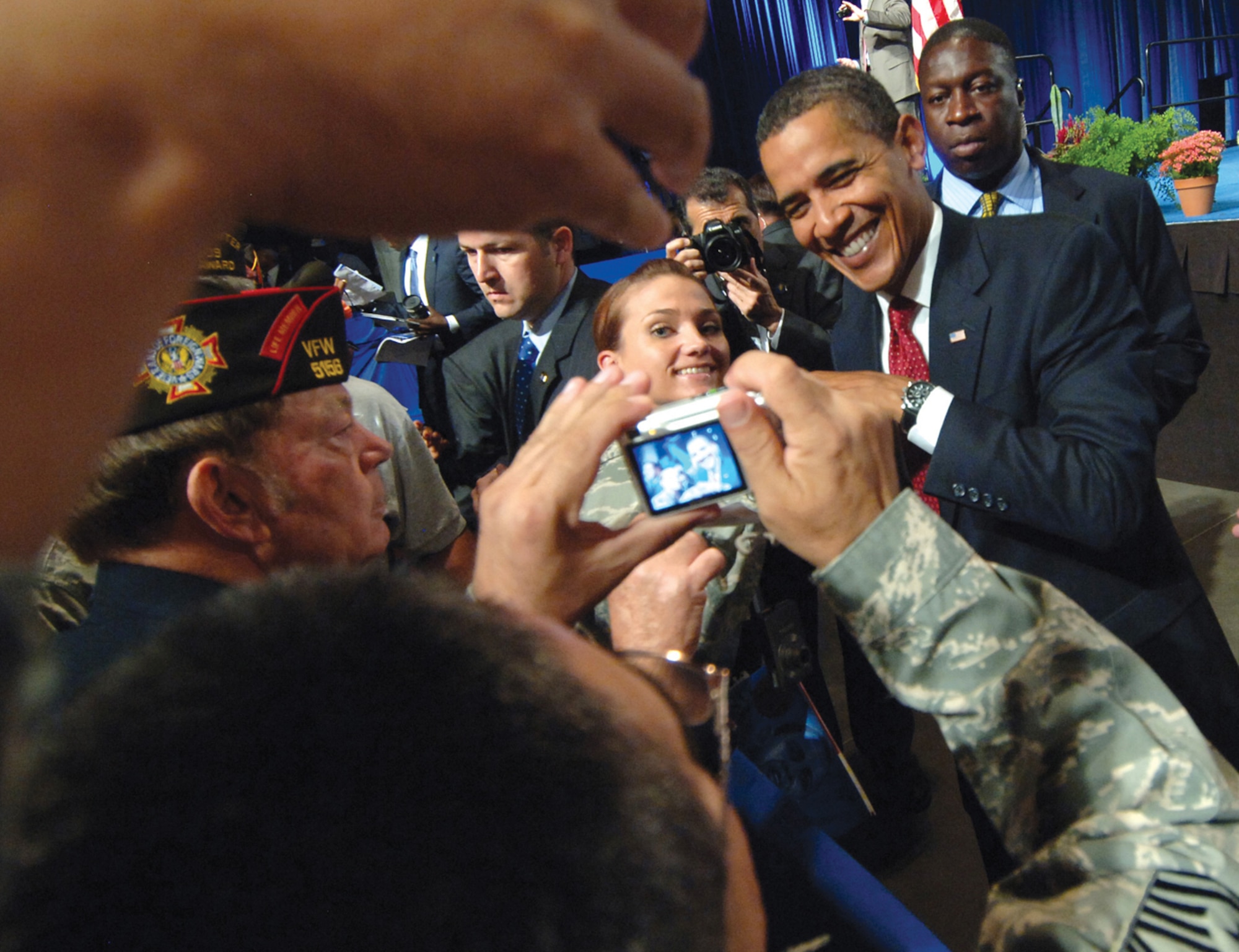 Capt. Kristen Gibson, 56th Operations Group Executive Officer, has her photo taken while giving President Barack Obama a "fist-bump" at the Veterans of Foreign Wars national convention held in downtown Phoenix, Aug. 17.  (U.S. Air Force photo by Tech. Sgt. Jeffrey A. Wolfe)
