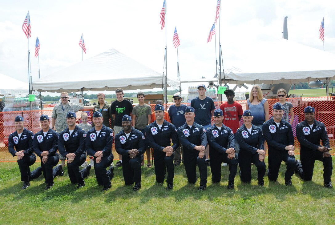 YOUNGSTOWN AIR RESERVE STATION, Ohio -- The U.S. Air Force Thunderbirds Air Demonstration team poses with the 910th Airlift Wing's Pilot for a Day program former honorees during the  "Thunder Over the Valley" Air Show and Open House preview Aug. 7, 2009. The PFAD program allows children with chronic or life-threatening illnesses to become an honorary Air Force Reserve 2nd Lt. and treats them to a day of fun at the air station. More than 40 children have participated in the program's inception 10 years ago. U.S. Air Force photo by Tech. Sgt. Rick Lisum 