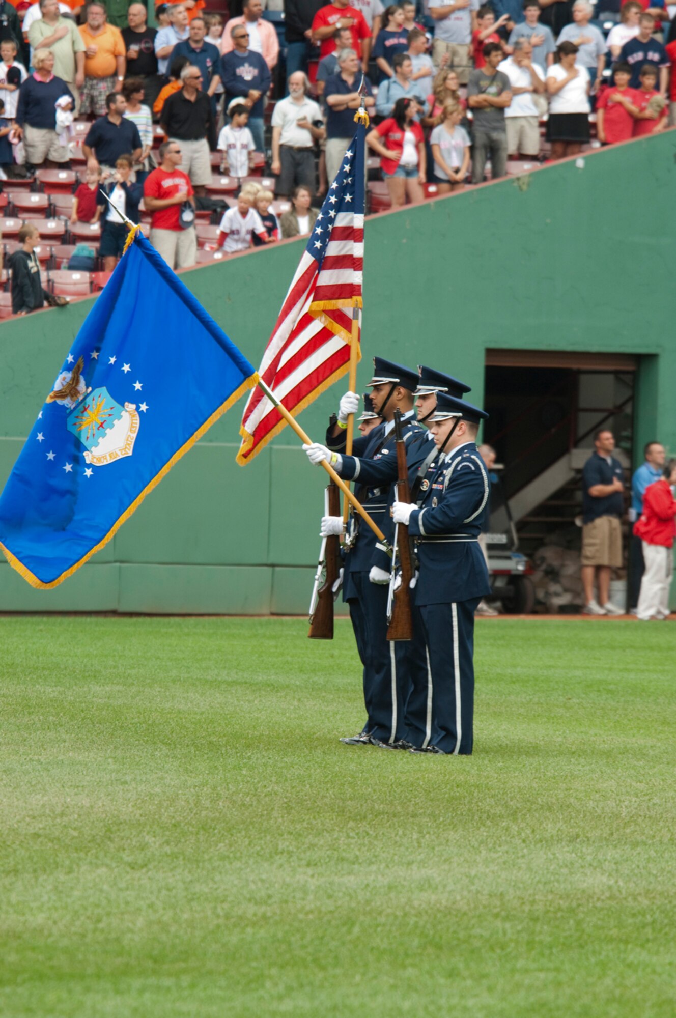 HANSCOM AIR FORCE BASE, Mass. –Members of the Hanscom Patriot Honor Guard participate in pre-game festivities on the field at Fenway Park on Aug. 13. More than 150 Airmen from Hanscom, as well as other service members from the local area, attended the Boston Red Sox game for free as part of the 'Tickets for Troops' program, in which season ticket holders donated their game tickets to active-duty troops.  (U.S. Air Force photo by Rick Berry)