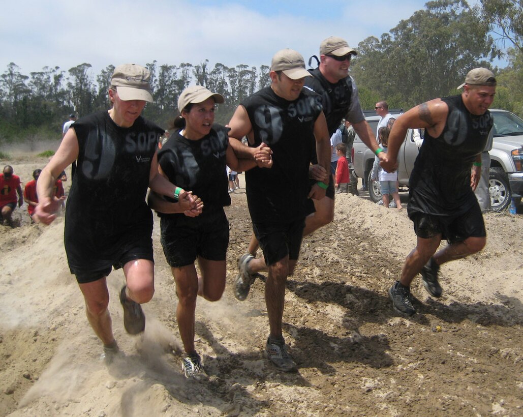 VANDENBERG AIR FORCE BASE, Calif. (AFRC) --  The AF Reserve 9th Space Operations Squadron team pulls together to finish in the Vandenberg Warrior Challenge Mud Run. Team members include (from left to right) Tech. Sgt. Wendy Jones, Tech. Sgt. Anamarie Aguirre, Staff Sgt. Matt Amick, Master Sgt. Chris Howard and Tech. Sgt. Gabriel Valle. The 9th SOPS is a world-class space operations squadron that trains and fights as a unit in support of the Joint Space Operations Center. (U.S. Air Force photo/ Courtesy photo)