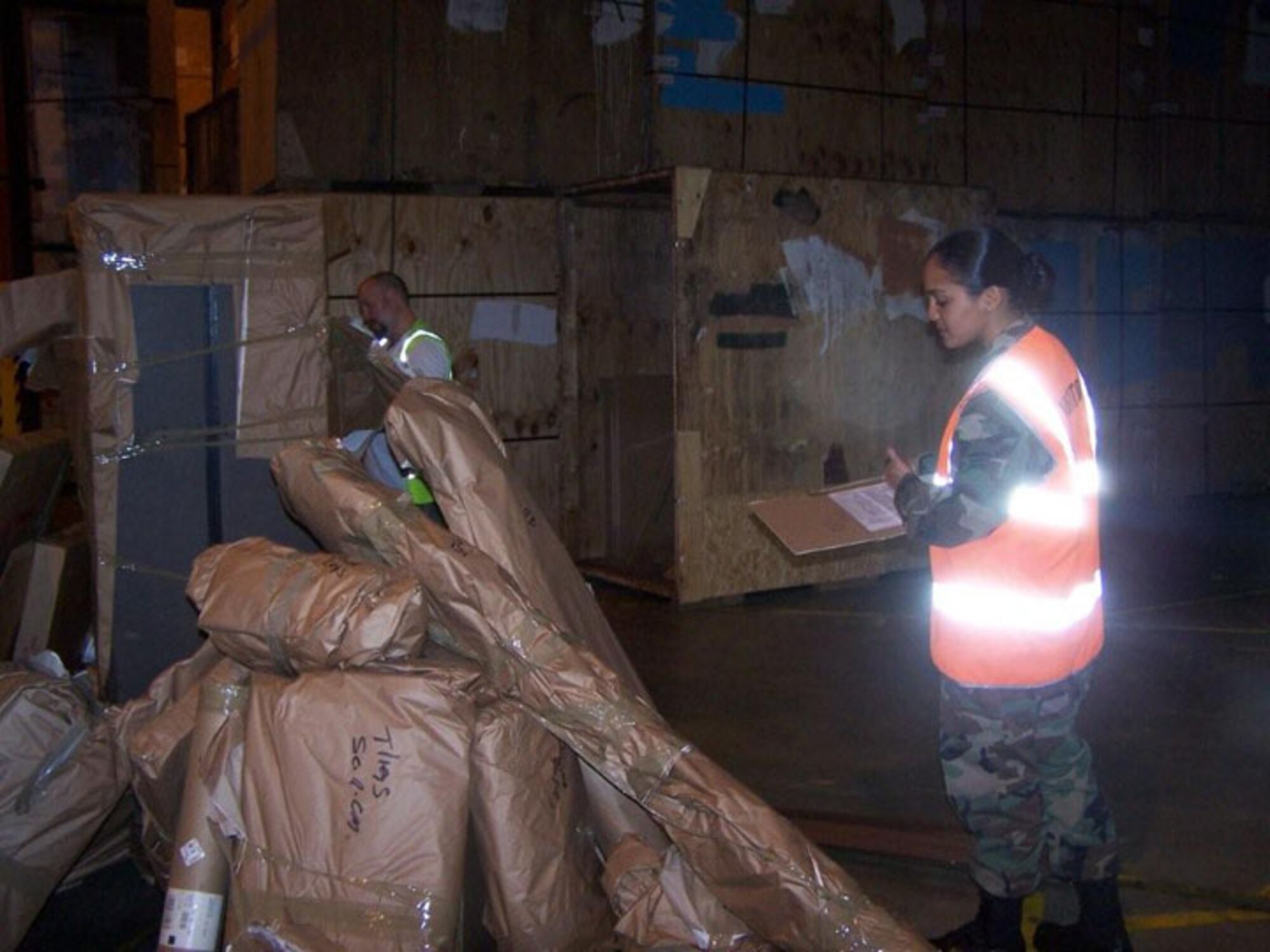 SEYMOUR JOHNSON AIR FORCE BASE, N.C. -- Senior Airman Nallelis Madrigal of travel management performs a "re-pack" for a military member's move. She thoroughly takes inventory of all of the household goods and watches the military service carrier pack and take inventory of the shipment. Airman Madrigal is a Reservist with the 916th Logistics Readiness Squadron and spent her annual tour in England. (U.S. Air Force photo by: SSgt. Monica Leonvelez, 916 LRS)