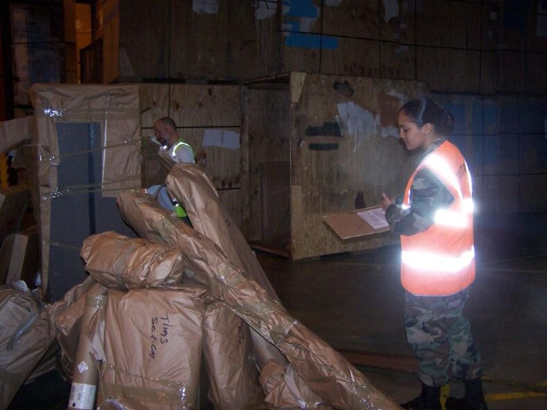 SEYMOUR JOHNSON AIR FORCE BASE, N.C. -- Senior Airman Nallelis Madrigal of travel management performs a "re-pack" for a military member's move.
 She thoroughly takes inventory of all of the household goods and watches the military service carrier pack and take inventory of the shipment. Airman Madrigal is a Reservist with the 916th Logistics Readiness Squadron and spent her annual tour in England. (U.S. Air Force photo by: SSgt. Monica Leonvelez, 916 LRS)
