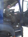 SEYMOUR JOHNSON AIR FORCE BASE, N.C. -- Senior Airman Danielle Hardy, a vehicle operations apprentice, drives a tractor trailer while on annual training at Mildenhall. This particular training offered a challenge as the steering column was on the other side of the vehicle and driving in England occurs on the left side of the road. (U.S. Air Force photo by: SSgt. Monica Leonvelez, 916 LRS)