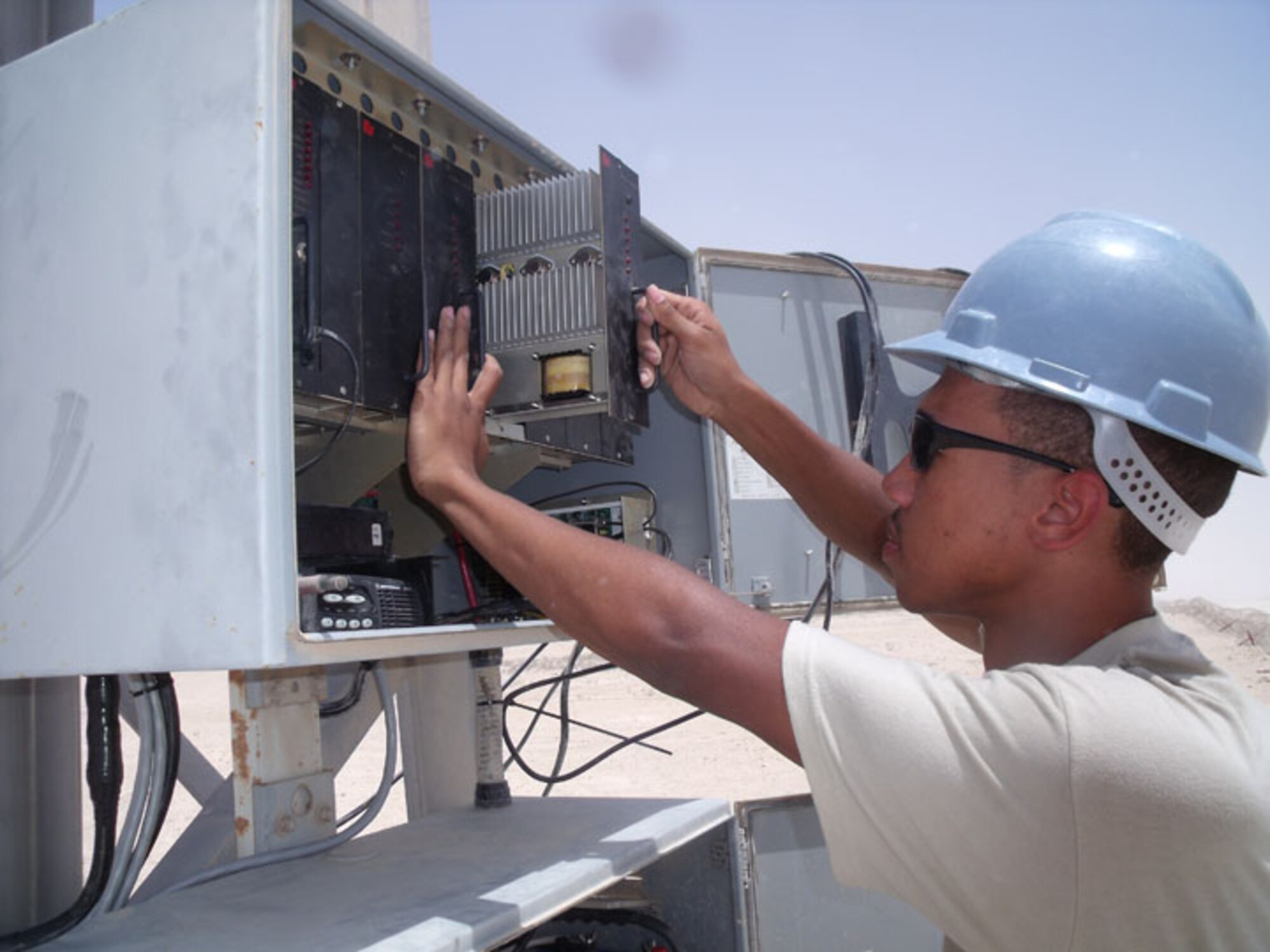 SEYMOUR JOHNSON AIR FORCE BASE, N.C. -- Senior Airman Christopher Twitty, a Reservist with the 916th Communication Squadron, helps move the Giant Voice notification system at Al Udied, Qatar. Airman Twitty is a ground radio maintenance apprentice.