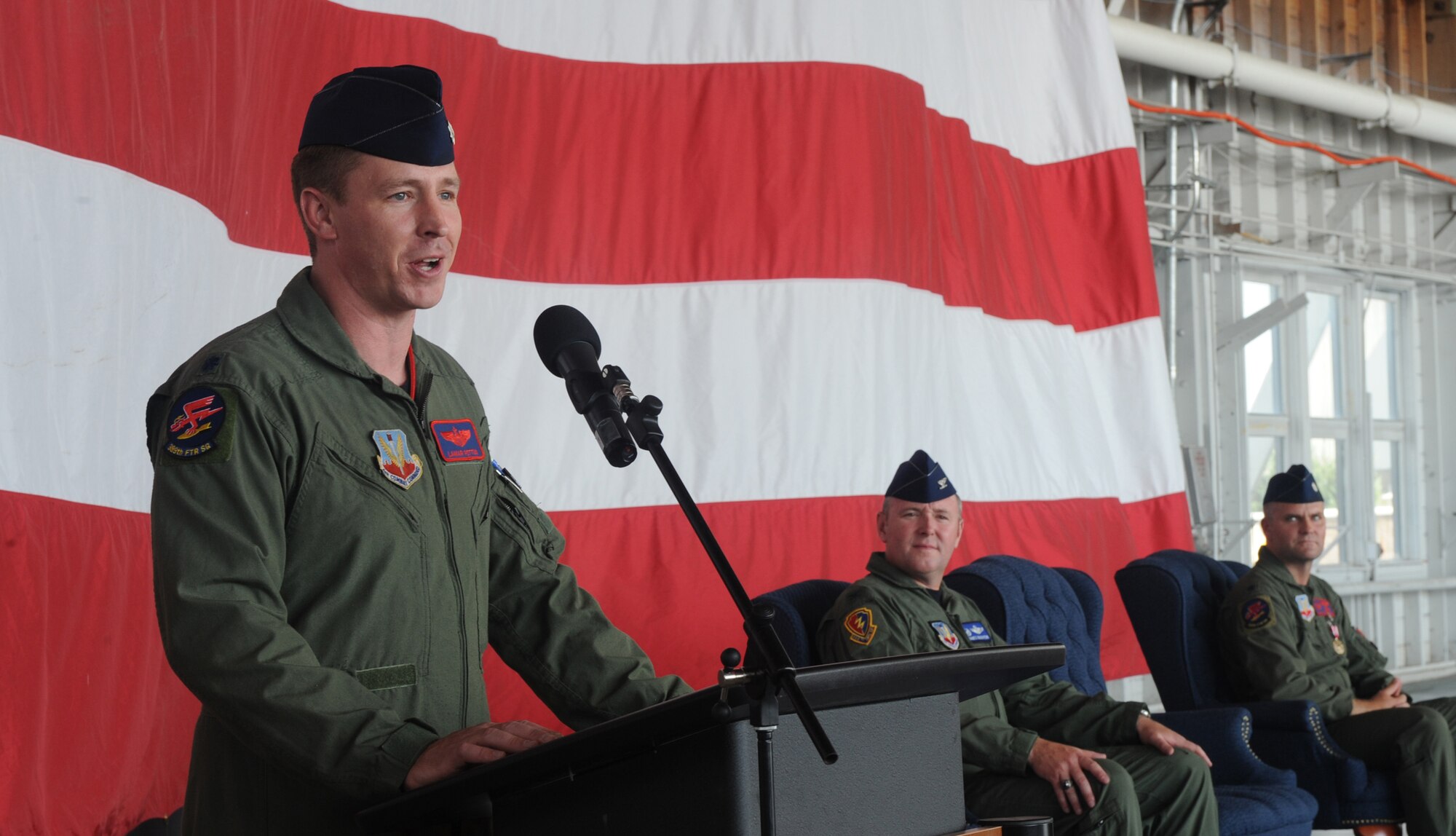 MOUNTAIN HOME AIR FORCE BASE, Idaho – Lt. Col. Lamar Pettus, 389th Fighter Squadron commander, speaks to the squadron during the change-of-command ceremony held at Hangar 201 Aug. 12. Colonel Pettus assumed command of the 389th FS from Colonel Koscheski during the ceremony. (U.S. Air Force photo by Airman 1st Class Renishia Richardson)
