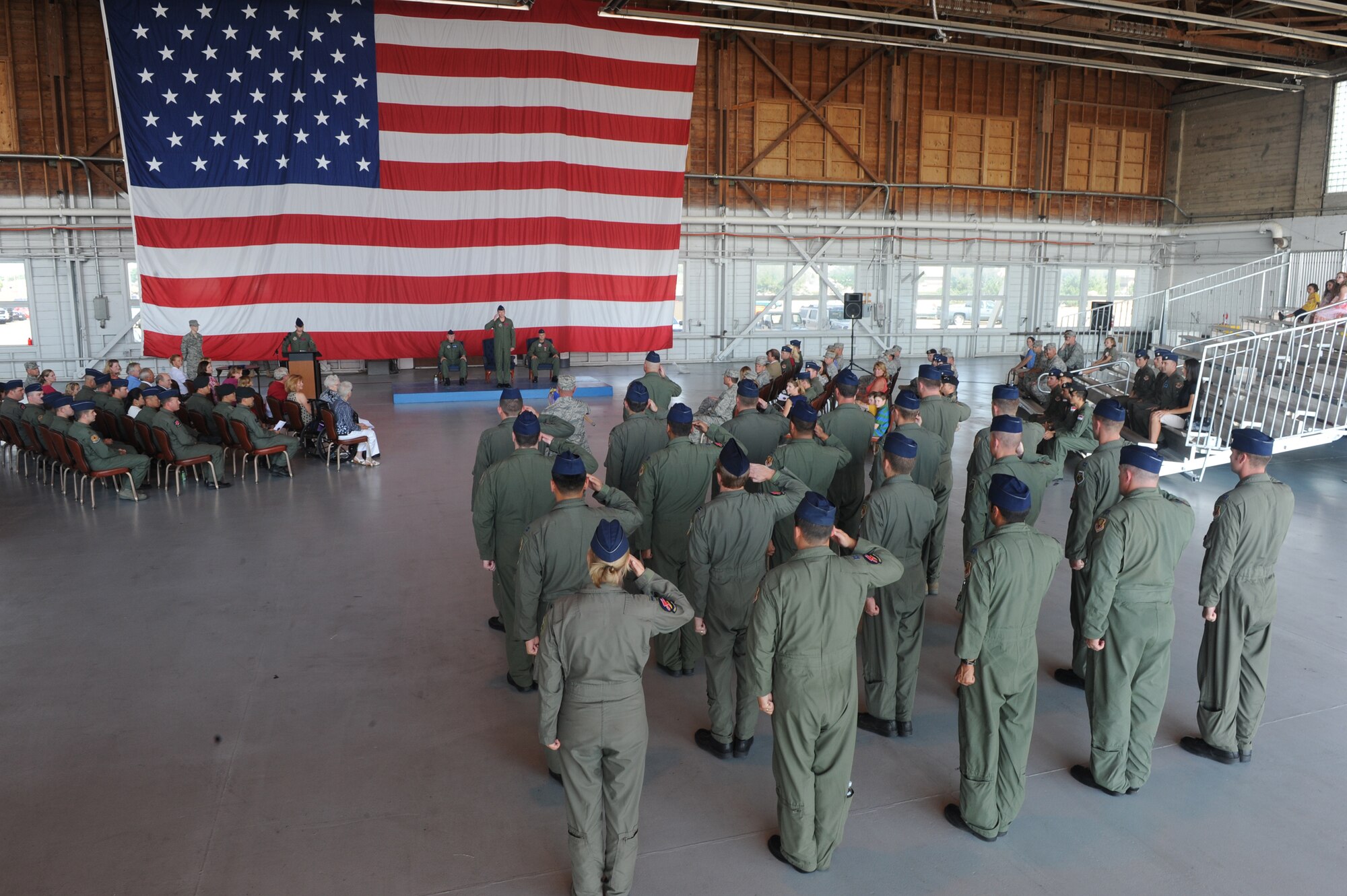 MOUNTAIN HOME AIR FORCE BASE, Idaho - Members of the 389th Fighter Squadron render their first salute to Lt. Col. Lamar Pettus during the change-of-command ceremony held at Hangar 201 Aug. 12. Colonel Pettus assumed command of the 389th FS from Colonel Koscheski during the ceremony. (U.S. Air Force photo by Airman 1st Class Renishia Richardson)