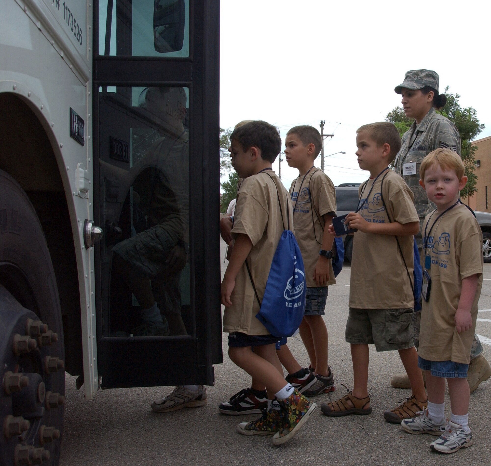 Children participating in Operation KIDS, Aug. 6 at Vance AFB, Okla., board the bus that will take them to their deployment site-- Camp Liberty in Hangar 170. Operation KIDS was a hands-on event for children of military families to learn about their parents’ deployment process. (U.S. Air Force photo/ 1st Lt. Agneta Murnan)