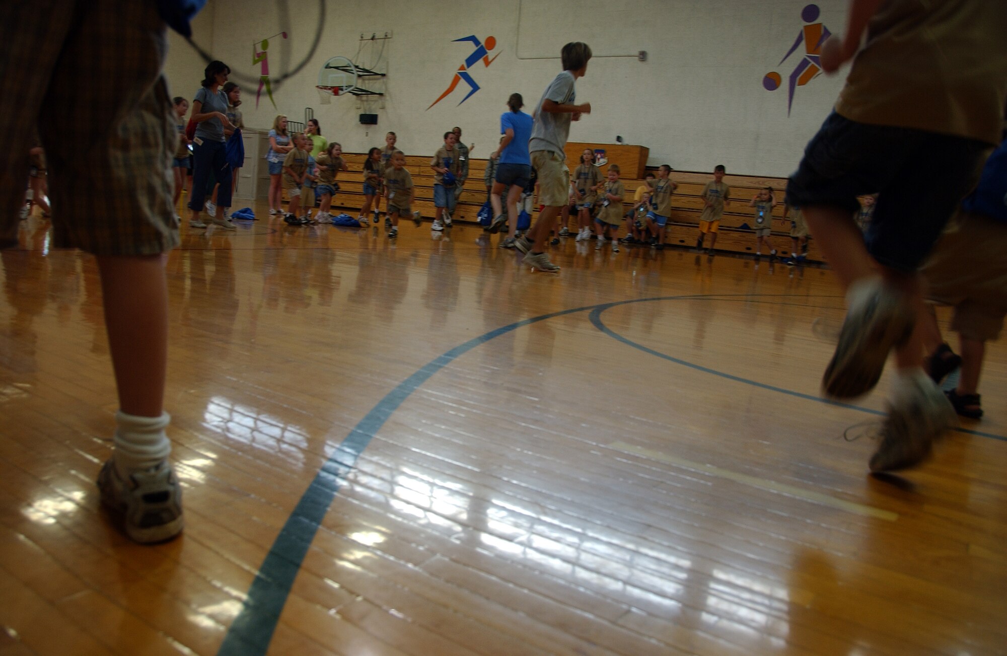 Children participating in Operation KIDS, Aug. 6 at Vance AFB, Okla., run in place in the Fitness Center as part of their physical training before “deploying” to Camp Liberty in Hangar 170. Operation KIDS was a hands-on event for children of military families to learn about their parents’ deployment process. (U.S. Air Force photo/ 1st Lt. Agneta Murnan)