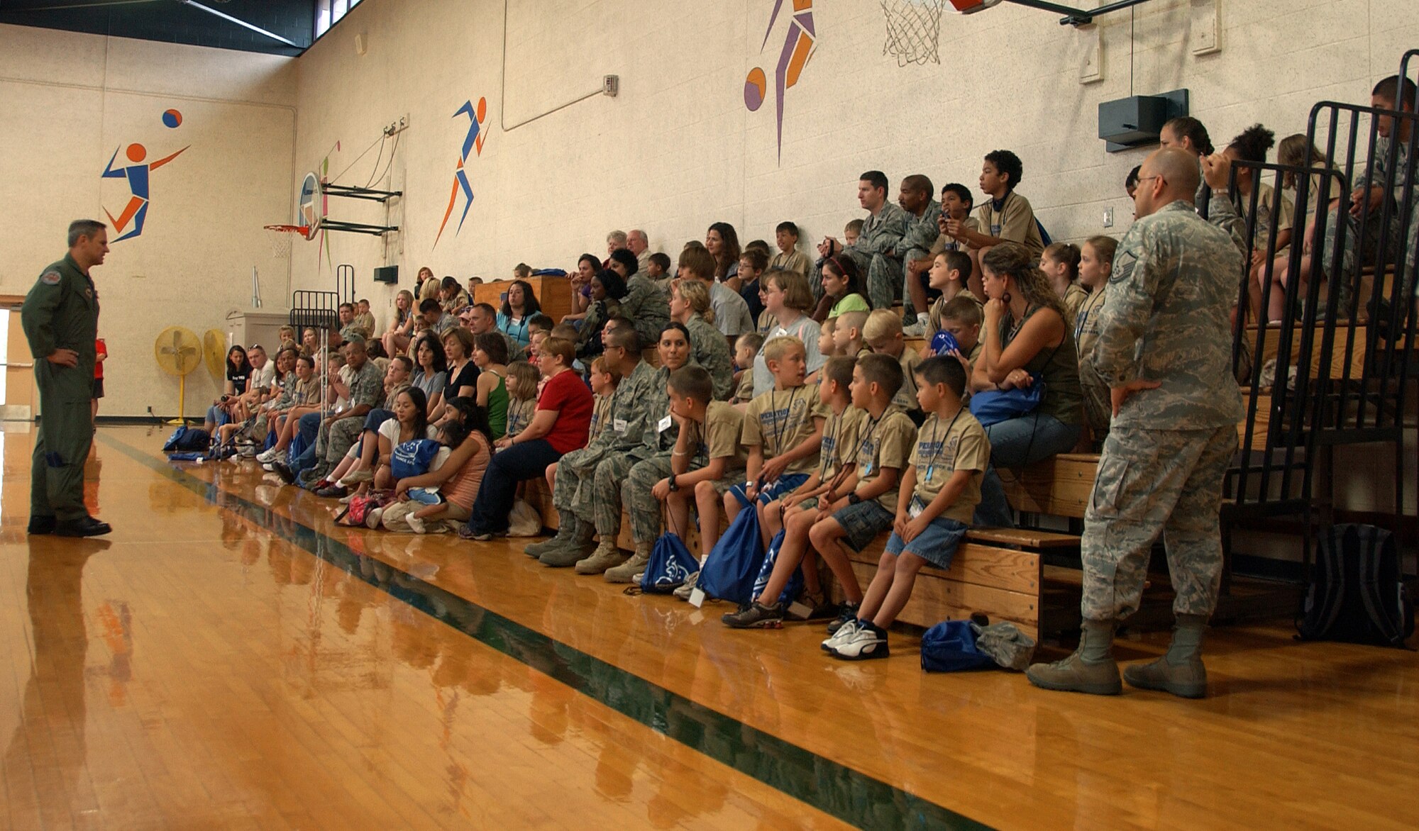 Col. Chris Nowland, 71st Flying Training Wing commander, briefs the children participating in the Operation KIDS event, Aug. 6 at Vance AFB, Okla. The young military family members “deployed” from the Fitness Center to Camp Liberty in Hangar 170. Operation KIDS was a hands-on event for children to learn about their parents’ deployment process. (U.S. Air Force photo/ 1st Lt. Agneta Murnan)