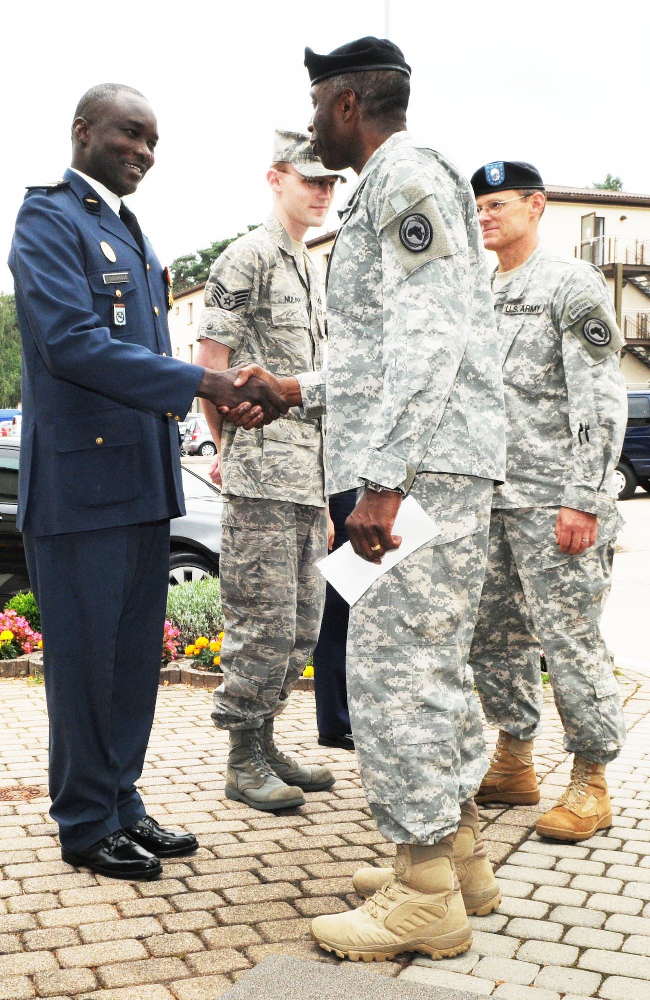 Gen. William “Kip” Ward, commander of U.S. Africa Command, greets Maj. Souleymane Ouedraogo prior to meeting with the 17th Air Force headquarters.  Major Ouedraogo was part of a delegation of officers from Burkina Faso and also attended the commander’s call.  The group was the first-ever military exchange from the West African nation to visit Ramstein AB. (USAF photo by Tech. Sgt. Alec Lloyd)