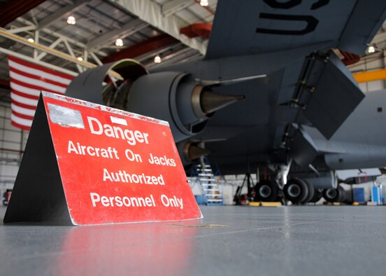 RAF MILDENHALL, England – A danger sign sits in hanger 814 to warn personnel in the immediate area that the aircraft is on jacks Aug. 13, 2009. Aircraft jacks are used to for a number of occasions such as gear changes and operational checks to simulate aircraft in the air to name a few. (U.S. Air Force photo by Staff Sgt. Jerry Fleshman)