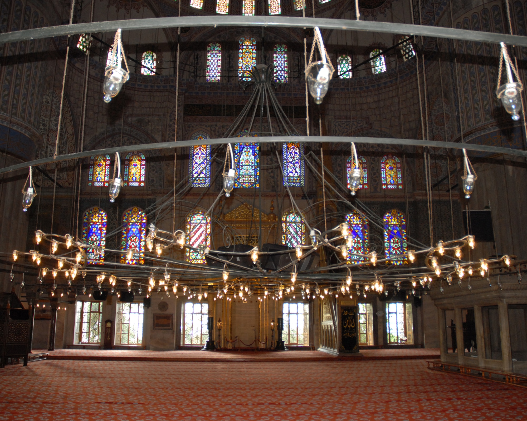 A chandelier hangs from the ceiling of the Sultan Ahmet Mosque or the Blue Mosque in Istanbul Turkey. The Blue Mosque receives its nick-name from the thousands of blue tiles that adorn the interior. Construction on the mosque began in 1606 and concluded in 1616. The mosque has six minarets and 260 windows. (U.S. Air Force photo/Staff Sgt. Lauren Padden)
