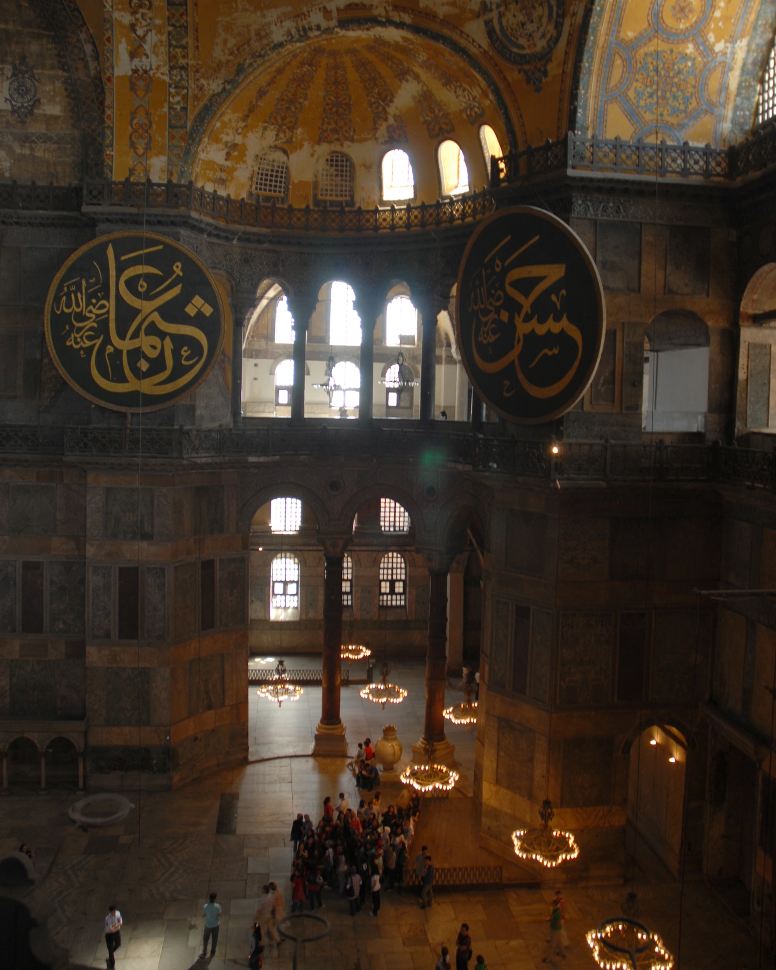 Two large medallions hang from the walls at the Aya Sofya in Istanbul Turkey. The medallions were crafted by master calligrapher Mastafa Izzet Efendi. The Aya Sofya or as it is called in English, the Church of the Divine Wisdom, was completed in 537 AD by Roman Emperor Justinian as a church and then was converted to a mosque in 1453 by Mehmet the Conqueror.  In 1935 Ataturk proclaimed the mosque a museum.  (U.S. Air Force photo/Staff Sgt. Lauren Padden)
