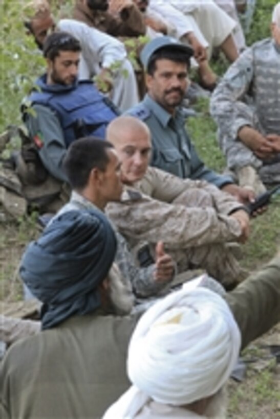 U.S. Marine Corps Capt. Andrew Schoenmaker with Bravo Company, 1st Battalion, 5th Marine Regiment talks with village elders during a shura in the Nawa district of Helmand province, Afghanistan, on Aug. 10, 2009.  A shura is a meeting between village elders to discuss any problems or issues the people may have.  Marines from 1st Battalion, 5th Marine Regiment are deployed with Regimental Combat Team 3 to conduct counter insurgency operations in partnership with Afghan security forces.  
