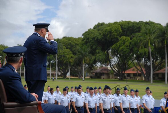 HICKAM AIR FORCE BASE, Hawaii – Gen. Gary North, Pacific Air Forces commander, returns a salute during a pass and review of troops during his change of command ceremony here Aug. 19. . Gen. Norton A. Schwartz, Air Force Chief of Staff, and Navy Adm. Timothy Keating, commander of United States Pacific Command, presided over the ceremony. The outgoing commander, Gen. Howie Chandler, is on his way to Washington D.C., to report to his new assignment as the Air Force Vice Chief of Staff.  Chief Master Sgt. Anthony Bishop, PACAF command chief, assisted with the passing of the flags. (U.S. Air Force photo/Senior Airman Gustavo Gonzalez)