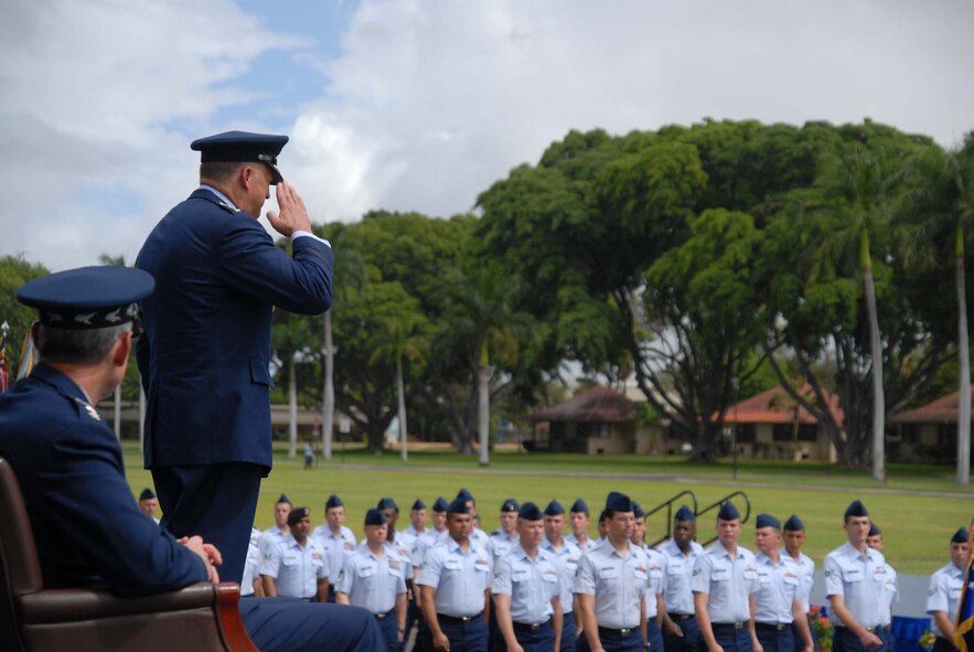 HICKAM AIR FORCE BASE, Hawaii – Gen. Gary North, Pacific Air Forces commander, returns a salute during a pass and review of troops during his change of command ceremony here Aug. 19. . Gen. Norton A. Schwartz, Air Force Chief of Staff, and Navy Adm. Timothy Keating, commander of United States Pacific Command, presided over the ceremony. The outgoing commander, Gen. Howie Chandler, is on his way to Washington D.C., to report to his new assignment as the Air Force Vice Chief of Staff.  Chief Master Sgt. Anthony Bishop, PACAF command chief, assisted with the passing of the flags. (U.S. Air Force photo/Senior Airman Gustavo Gonzalez)