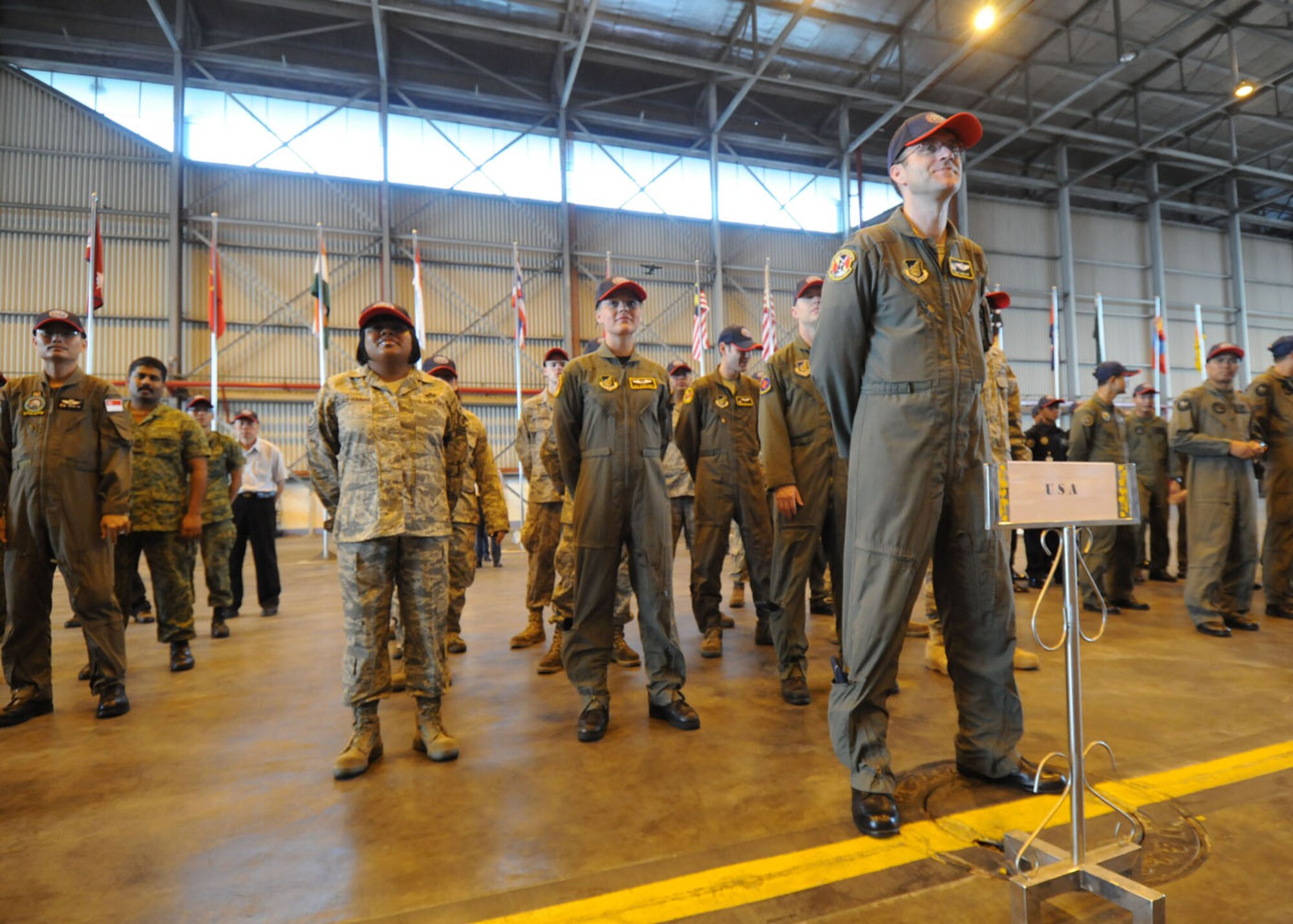SUBANG ROYAL MALAYSIAN AIR FORCE BASE, Malaysia -- Lt. Col. David Kincaid, 36th Airlift Squadron commander, leads a formation of members the 36th AS, 374th Operations Support Squadron and 374th Maintenance Squadron, all from Yokota Air Base, Japan, during the Pacific Airlift Rally 2009 opening ceremony Aug.18 here. The PAR is a bi-annual exercise involving Pacific Rim nations which enhances military airlift interoperability with a focus in humanitarian assistance and disaster relief operations. The exercise consists of a tabletop exercise and a field-training exercise involving three C-130 aircraft from the 374th Airlift Wing Yokota Air Base Japan and one C-130 each from the Royal Malaysian, Royal Australian Air Force, Republic of Singapore Air Force and Royal New Zealand Air Force. (U.S. Air Force photo/ Staff Sgt. Veronica Pierce)