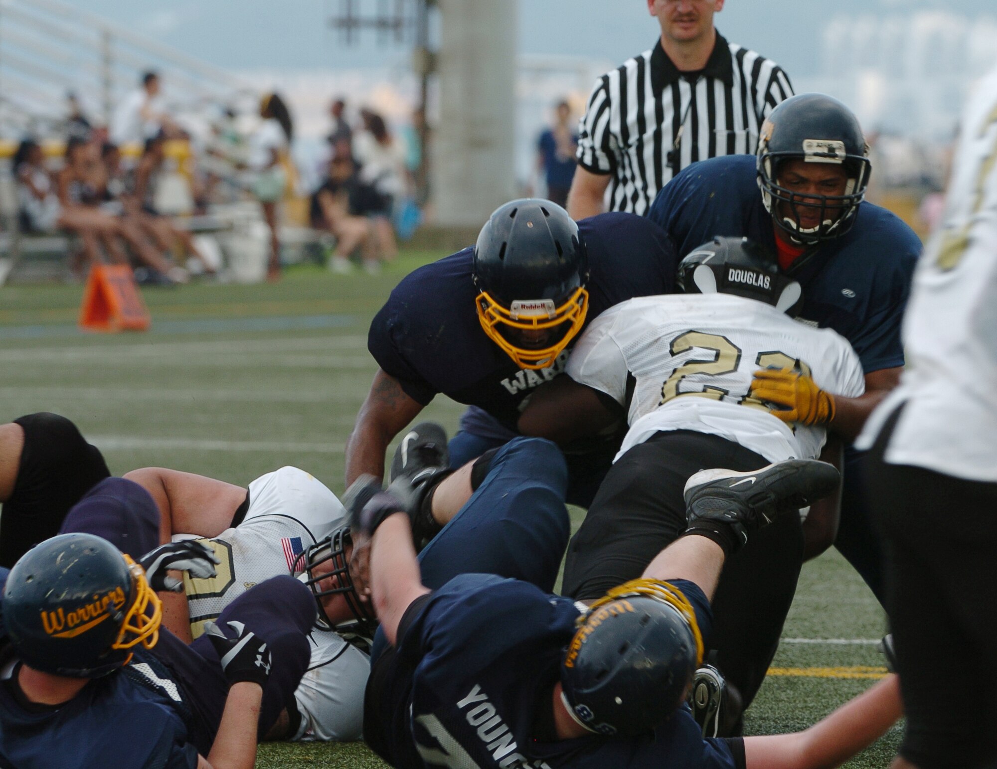 YOKOSUKA, Japan -- The Yokota Warriors' defense holds firm during Yokota's 18-12 defeat of the Yokosuka Seahawks Aug. 1 in a semi-final game of the U.S. Forces Japan-American Football League playoffs. Yokota earned its third Torii Bowl, or championship, berth since the USFJ-AFL began in 2000. The Warriors lost at Yokosuka 15-12 in 2000 and 30-21 at Misawa in 2005. Yokota travels to Kadena Air Base Aug. 28 to take on Camp Foster in the championship game. (U.S. Air Force photo/Master Sgt. Matt Summers) 