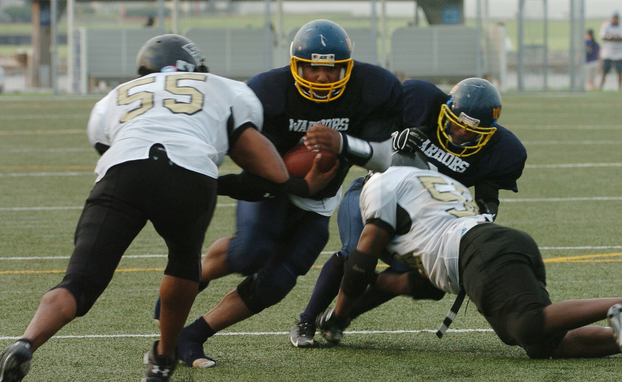 YOKOSUKA, Japan -- Yokota Warriors' quarterback Ryan Jones bounces off a shoulder tackle to score a game-tying touchdown late in the fourth quarter of Yokota's 18-12 defeat of the Yokosuka Seahawks Aug. 1 in a semi-final game of the U.S. Forces Japan-American Football League playoffs. Yokota earned its third Torii Bowl, or championship, berth since the USFJ-AFL began in 2000. The Warriors lost at Yokosuka 15-12 in 2000 and 30-21 at Misawa in 2005. Yokota travels to Kadena Air Base Aug. 28 to take on Camp Foster in the championship game. (U.S. Air Force photo/Master Sgt. Matt Summers) 
