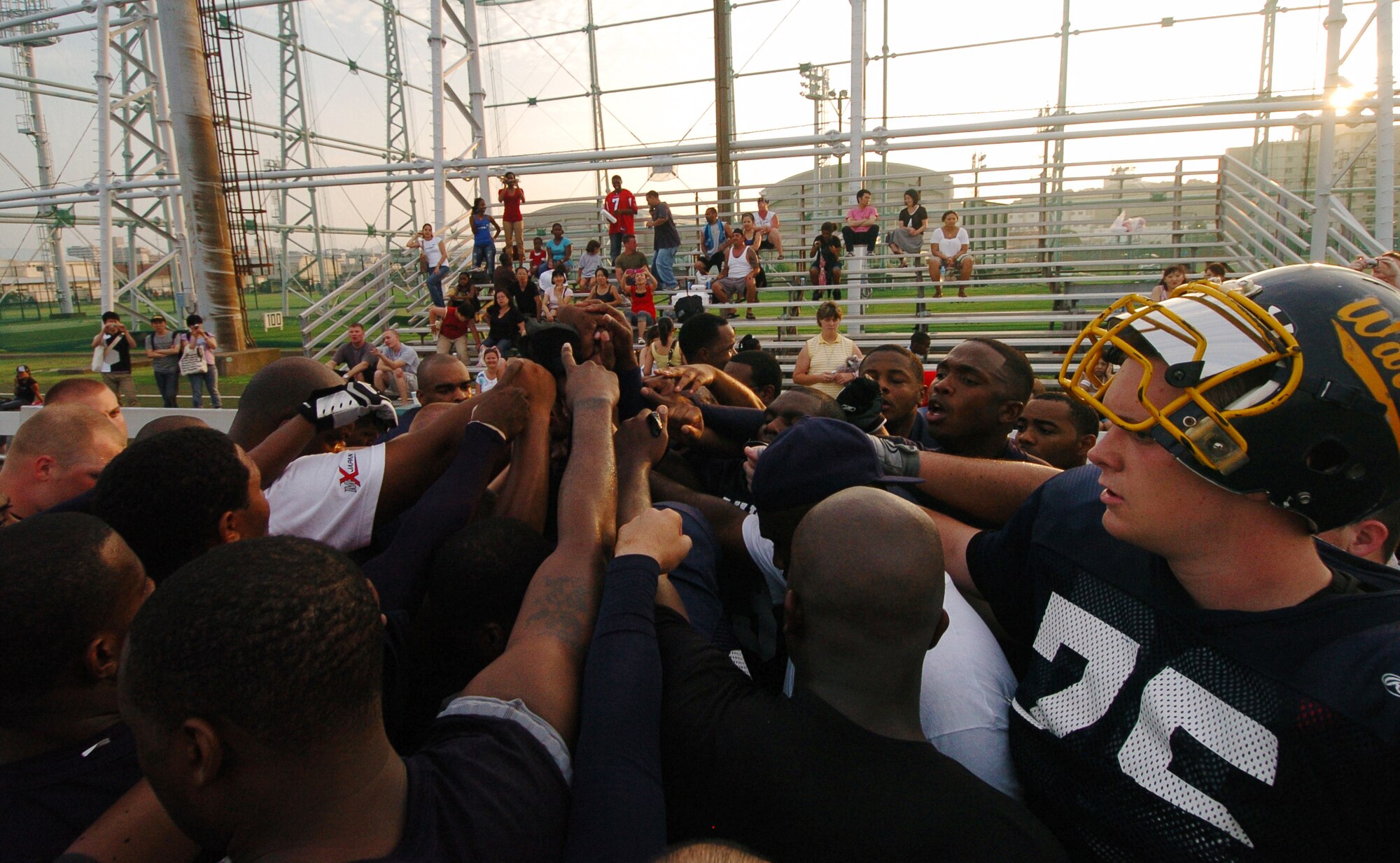 YOKOSUKA, Japan -- The Yokota Warriors' celebrate with their fans following Yokota's 18-12 defeat of the Yokosuka Seahawks Aug. 1 in a semi-final game of the U.S. Forces Japan-American Football League playoffs. Yokota earned its third Torii Bowl, or championship, berth since the USFJ-AFL began in 2000. The Warriors lost at Yokosuka 15-12 in 2000 and 30-21 at Misawa in 2005. Yokota travels to Kadena Air Base Aug. 28 to take on Camp Foster in the championship game. (U.S. Air Force photo/Master Sgt. Matt Summers) 