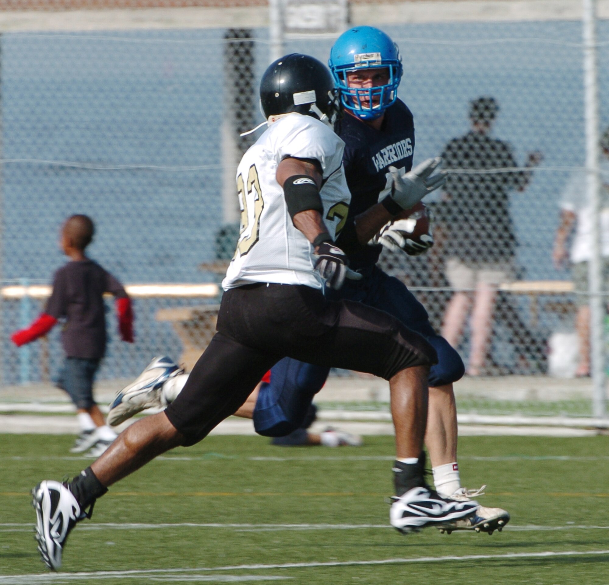 YOKOSUKA, Japan -- Yokota Warriors' running back Kevin Fortin eyes a defender on a 40-yard gain during Yokota's 18-12 defeat of the Yokosuka Seahawks Aug. 1 in a semi-final game of the U.S. Forces Japan-American Football League playoffs. Yokota earned its third Torii Bowl, or championship, berth since the USFJ-AFL began in 2000. The Warriors lost at Yokosuka 15-12 in 2000 and 30-21 at Misawa in 2005. Yokota travels to Kadena Air Base Aug. 28 to take on Camp Foster in the championship game. (U.S. Air Force photo/Master Sgt. Matt Summers) 

