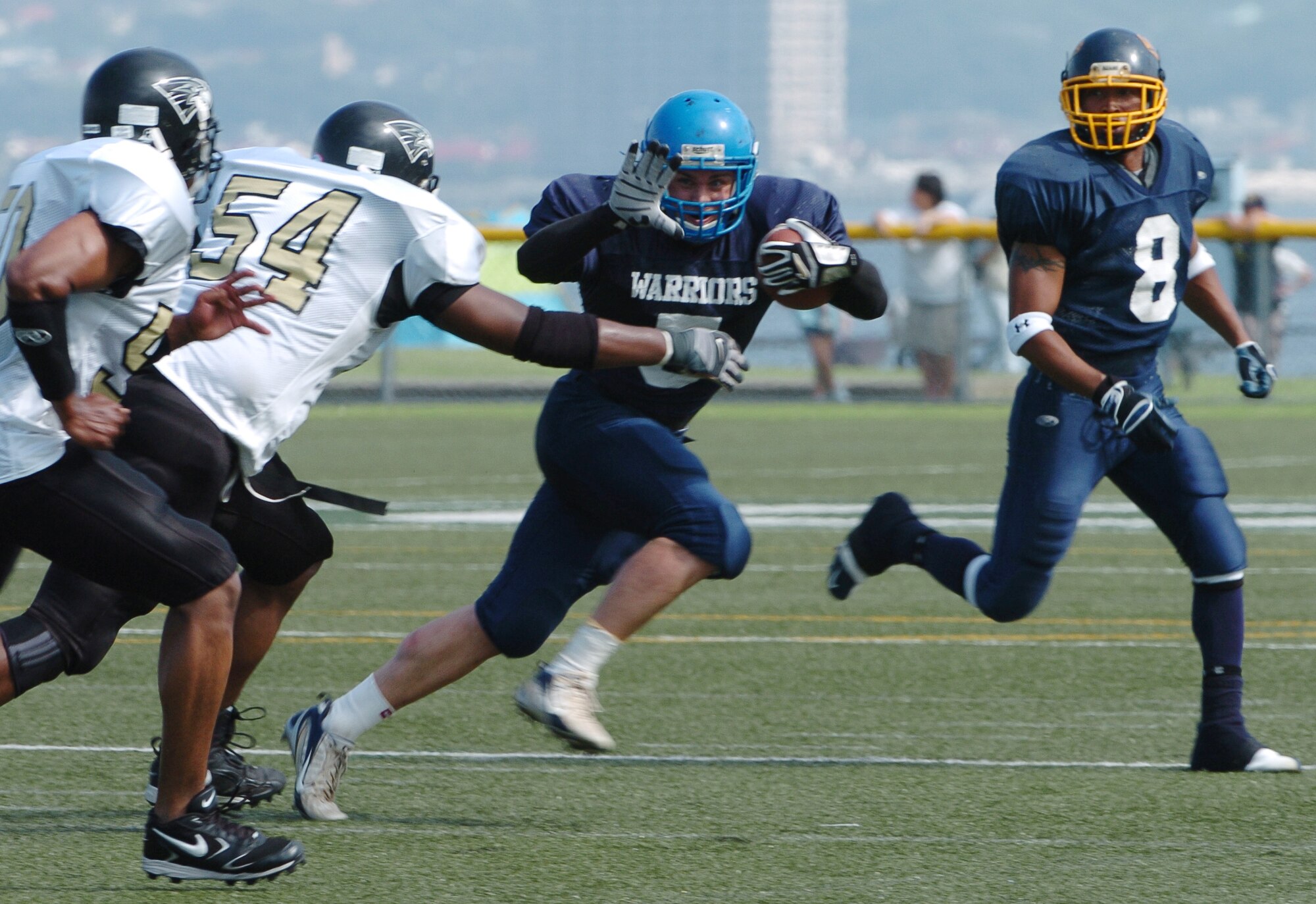 YOKOSUKA, Japan -- Yokota Warriors' running back Kevin Fortin fights off an arm tackle during Yokota's 18-12 defeat of the Yokosuka Seahawks Aug. 1 in a semi-final game of the U.S. Forces Japan-American Football League playoffs. Yokota earned its third Torii Bowl, or championship, berth since the USFJ-AFL began in 2000. The Warriors lost at Yokosuka 15-12 in 2000 and 30-21 at Misawa in 2005. Yokota travels to Kadena Air Base Aug. 28 to take on Camp Foster in the championship game. (U.S. Air Force photo/Master Sgt. Matt Summers) 

