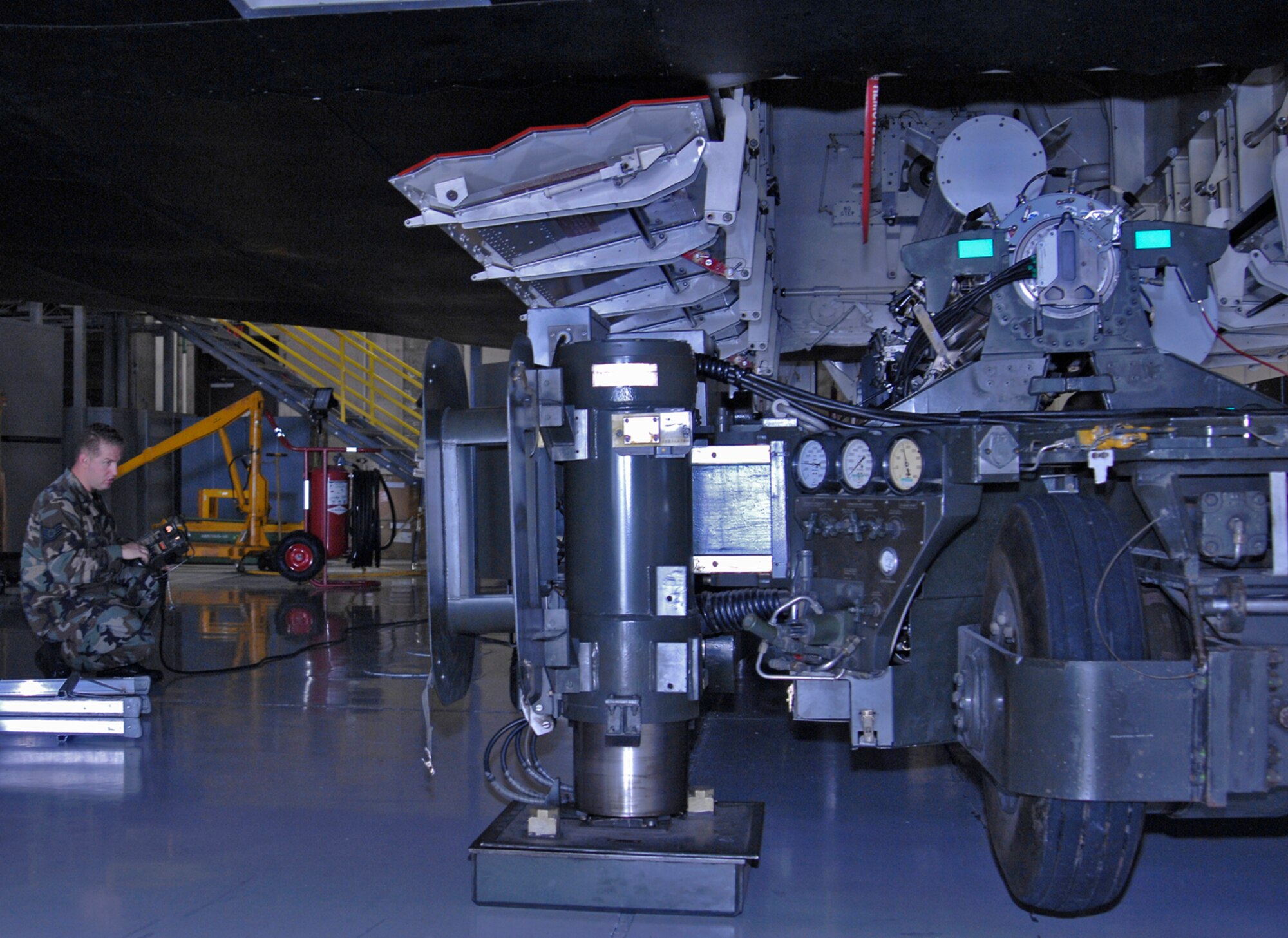 WHITEMAN AIR FORCE BASE, Mo. – Tech. Sgt. Robert Kirkham, Loading Standardization Crew member, uses a weapons trailer Aug. 14 to remove a rotary launch assembly from the Weapons Load Trainer. (U.S. Air Force photo/Staff Sgt. Jason Barebo)