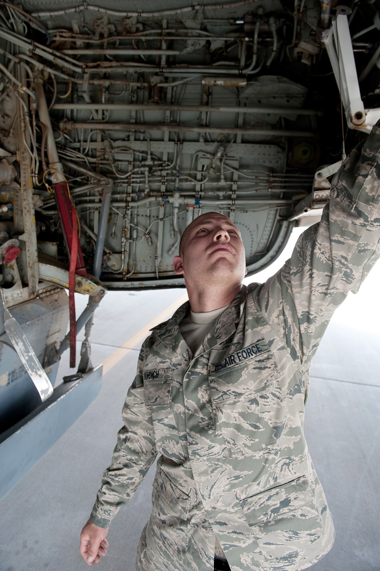Staff Sgt. Marcus Yancich performs a preflight check to ensure a KC-135 Stratotanker is safe to fly Aug. 11 at an air base in Southwest Asia. The KC-135 provides aerial refueling support to Air Force, Navy and Marine Corps and allied nation aircraft. Sergeant Yancich is a 340th Aircraft Maintenance Unit crew chief. He is a native of New Orleans and is deployed from MacDill Air Force Base, Fla. (U.S. Air Force photo/Staff Sgt. Robert Barney) 