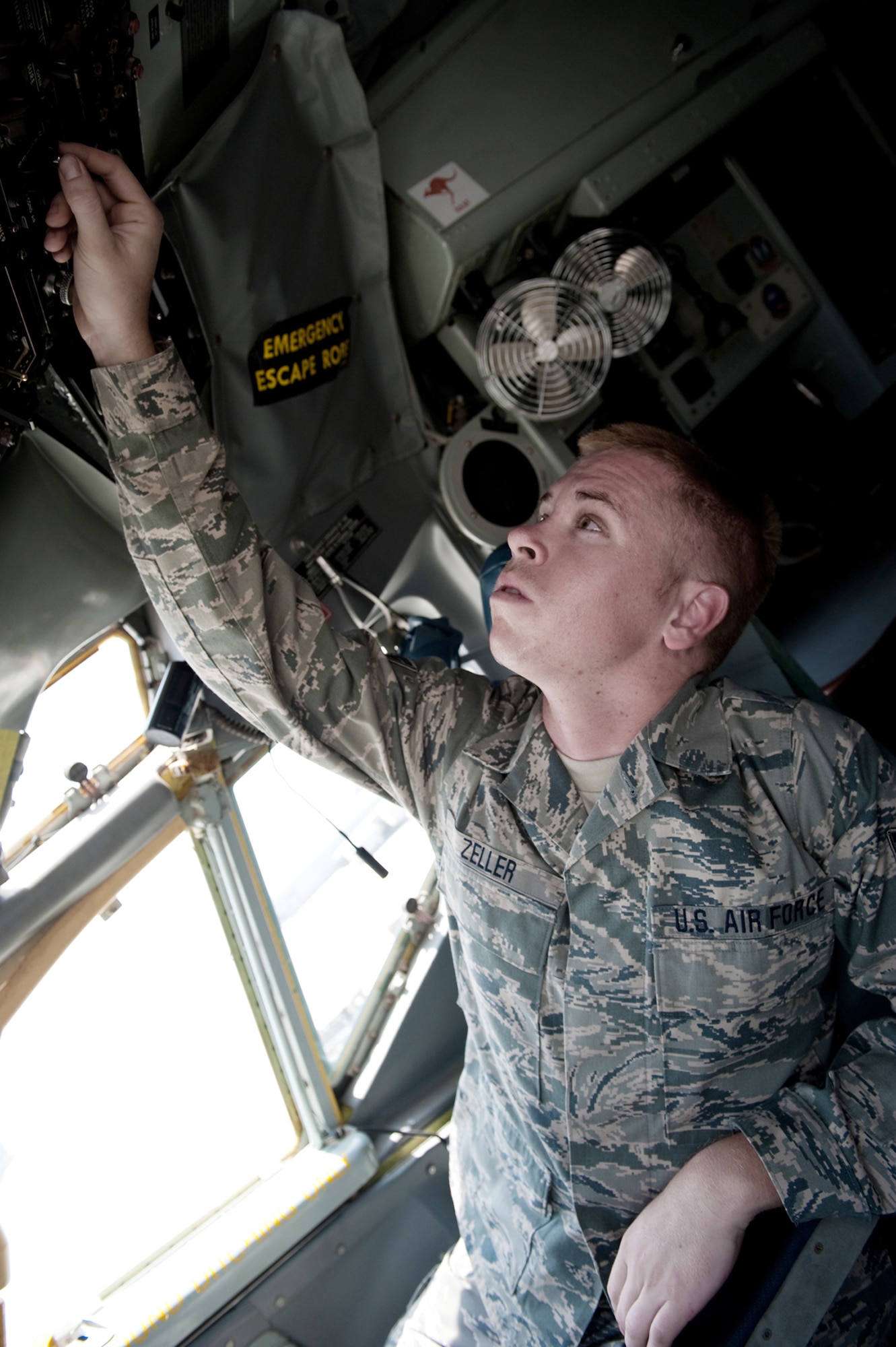 Senior Airman Ryne Zeller performs a preflight check to ensure a KC-135 Stratotanker is safe to fly Aug. 11 at an air base in Southwest Asia. The KC-135 provides aerial refueling support to Air Force, Navy and Marine Corps and allied nation aircraft. Airman Zeller is a 340th Aircraft Maintenance Unit aircraft electrical environmental systems technician. He is a native of Chandler, Ariz., and is deployed from the Arizona Air National Guard. (U.S. Air Force photo/Staff Sgt. Robert Barney) 