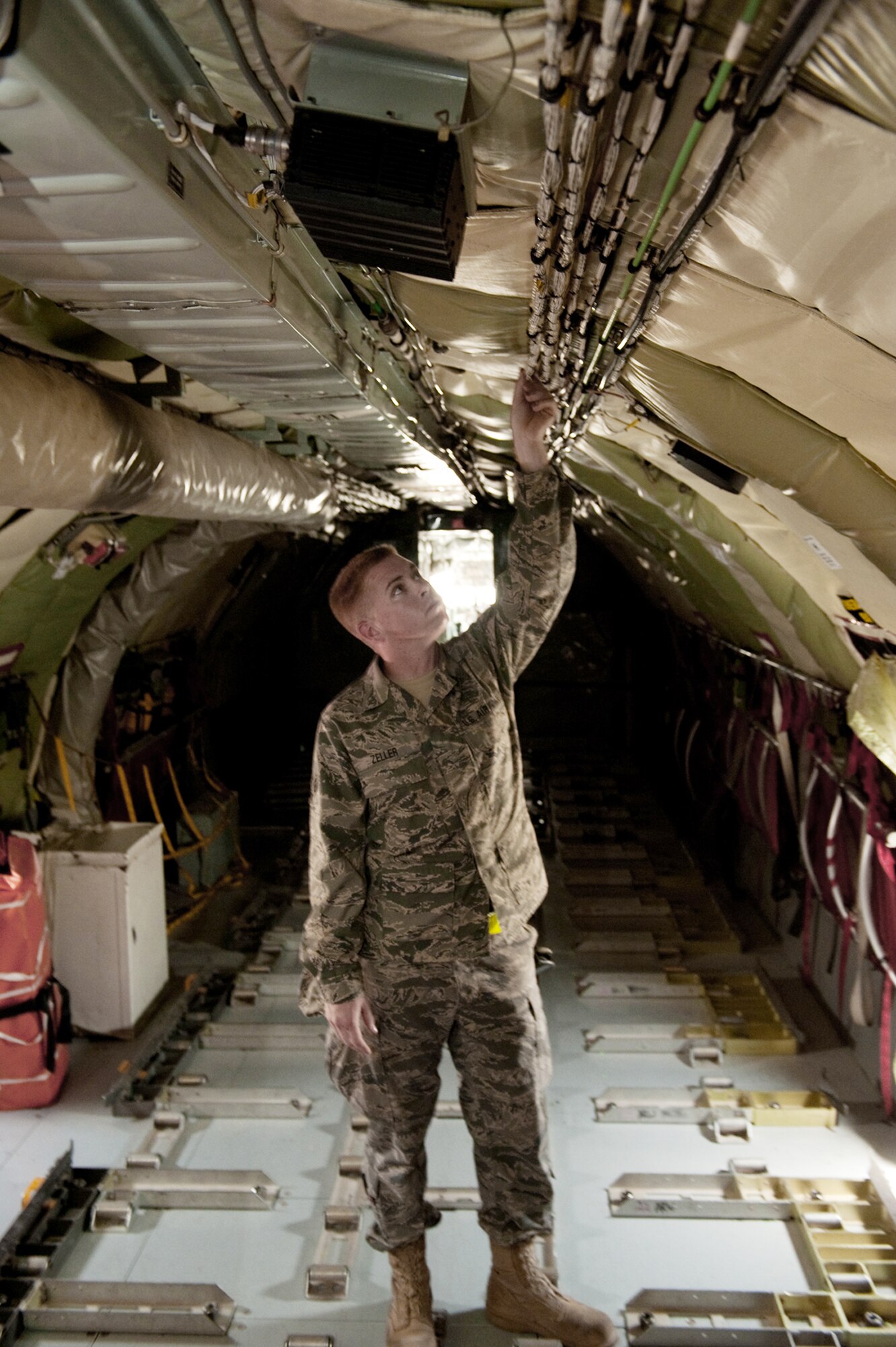 Senior Airman Ryne Zeller performs a preflight check to ensure a KC-135 Stratotanker is safe to fly Aug. 11 at an air base in Southwest Asia. The KC-135 provides aerial refueling support to Air Force, Navy and Marine Corps and allied nation aircraft. Airman Zeller is a 340th Aircraft Maintenance Unit aircraft electrical environmental systems technician. He is a native of Chandler, Ariz., and is deployed from the Arizona Air National Guard. (U.S. Air Force photo/Staff Sgt. Robert Barney) 